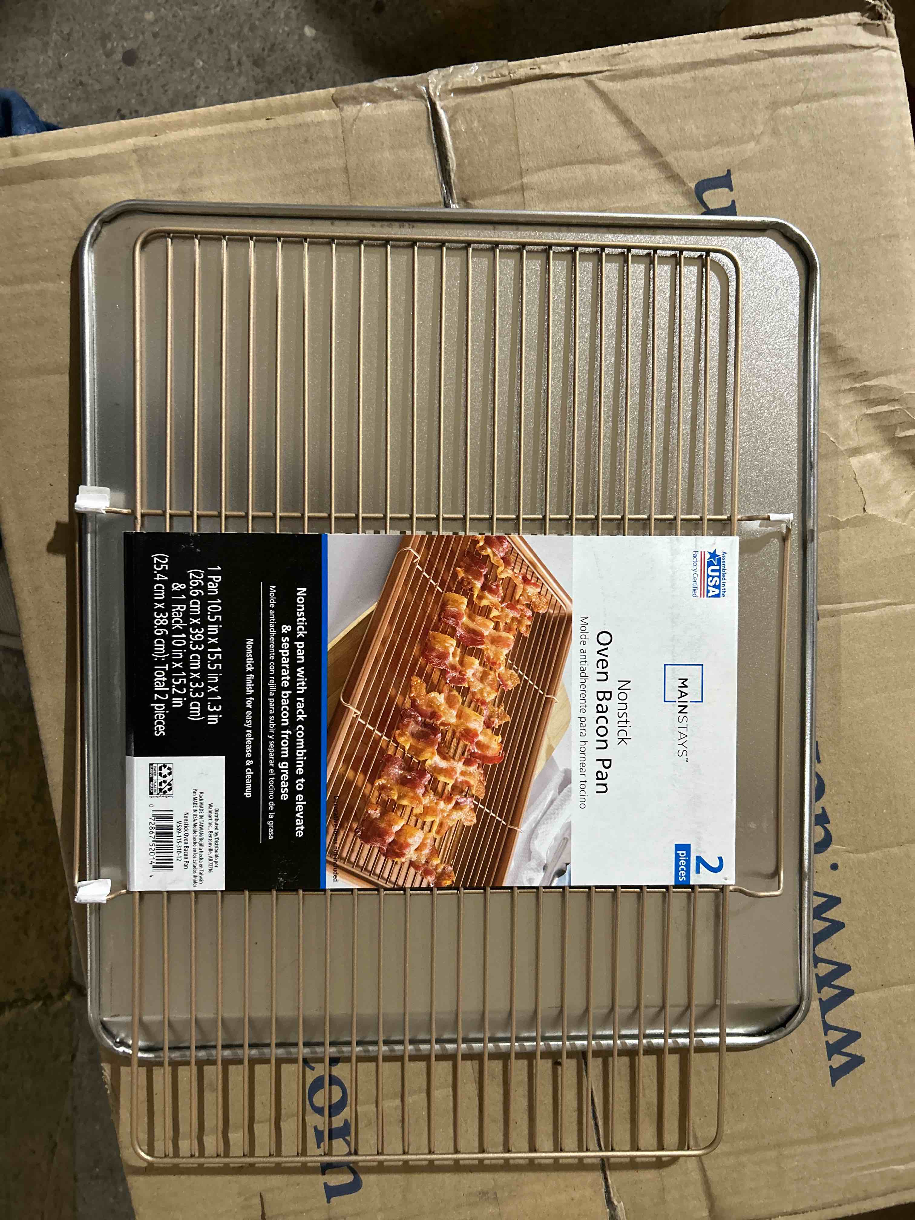 box of assorted cookware essentials, cupcake pans, oven bacon pan,, loaf pans, party folks, coffee filter, pickle picker, poultry lacers, peeler/grater, tin pizza pans, ect..