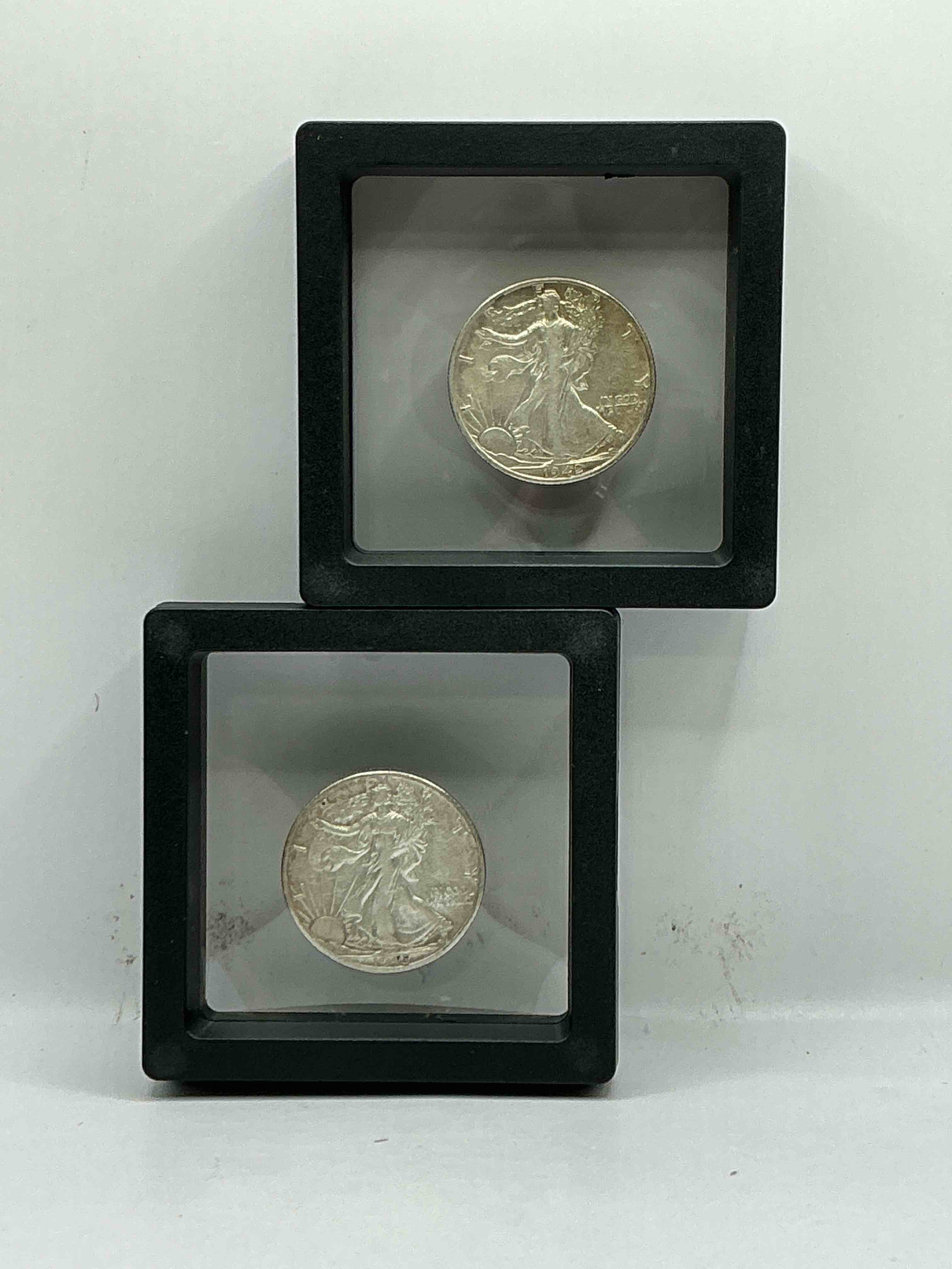 World War II Silver! Antique U.S. Silver! Liberty Walking Silver Fine U.S. Silver Half Dollar! This Striking Half Dollars Were Minted From 1916-1947 & Have Become Some Of The Most Collectible Coins In History! Here Is A Striking Circulated Example From 1942 & 1945! Appears Uncirculated! Liberty Walking Coins Are 90% Fine U.S. Silver, A Great Investment In Precious Metal!