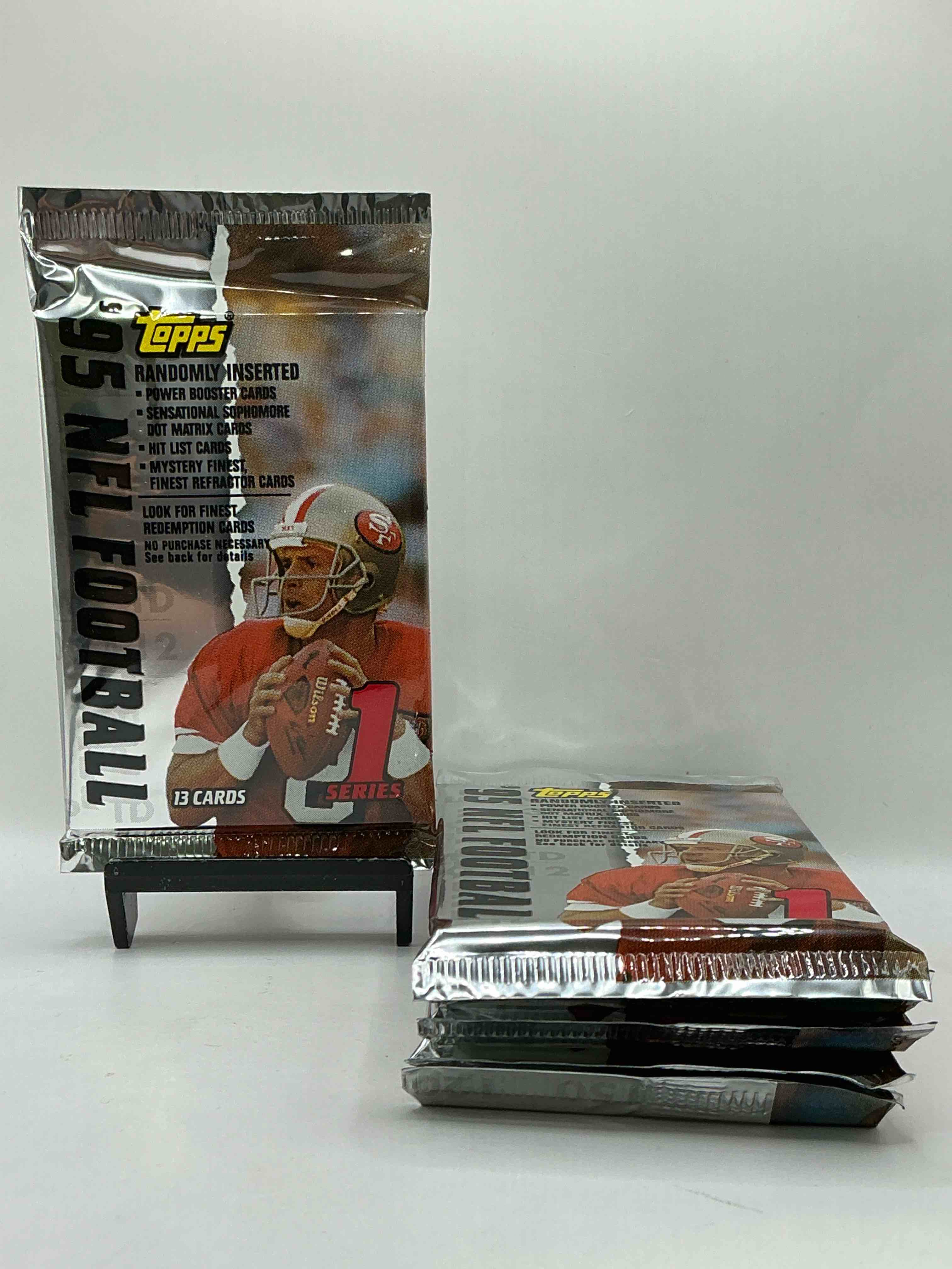 1995 NFL Football! Topps Series 1 NFL Football… 13 Cards Per Pack! Look For Legends, Rookies & More! Also Look For Randomly Inserted Power Booster, Sensational Sophomore, Hit List Cards & More! 90’s Football!