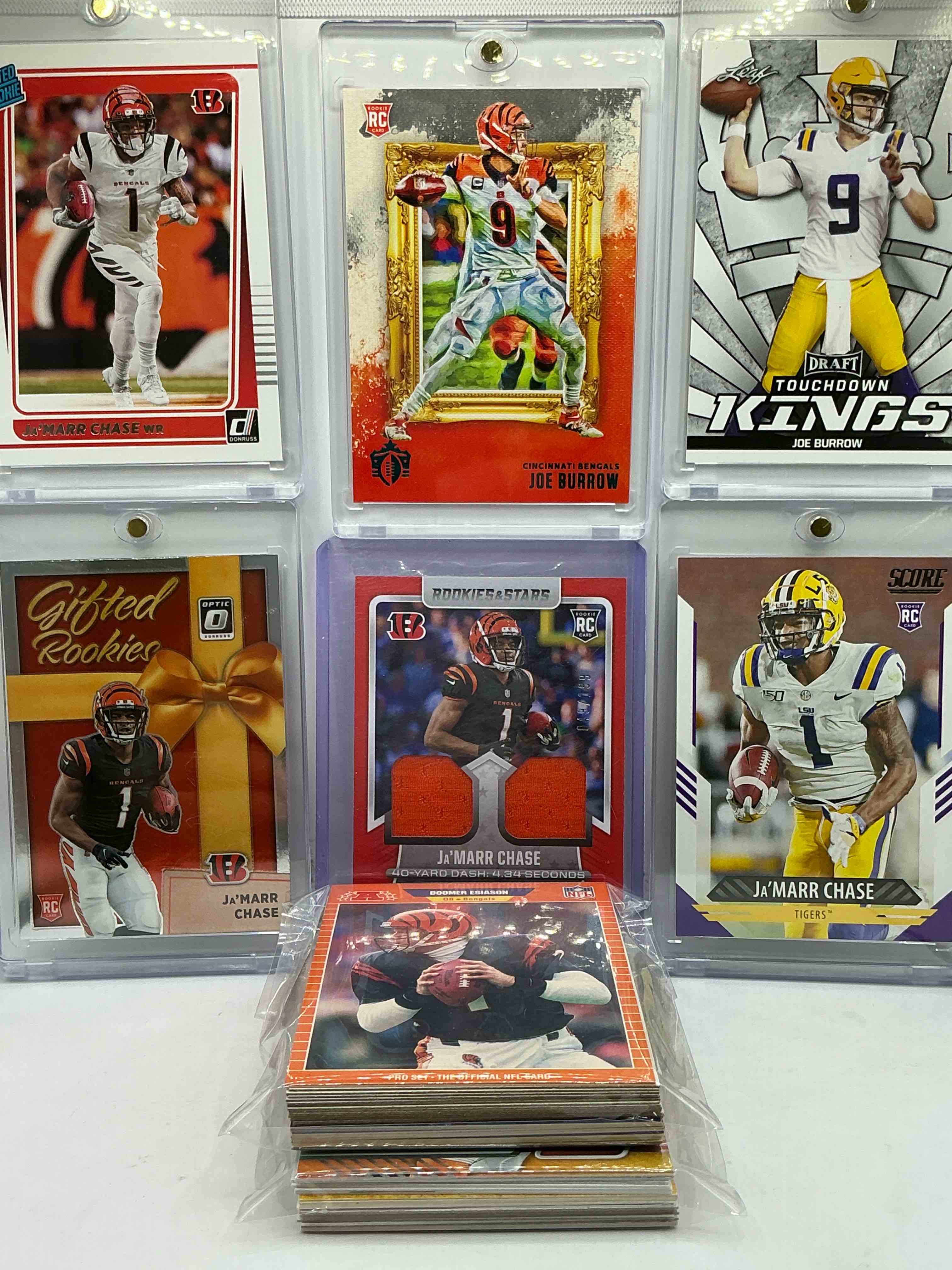 Ja’marr Chase Cross Training Double Orange Patch Rookie Card /199, Ja’marr Chase Donruss Rated Rookie Card, Joe Burrow Chronicles Rookie Card, Optic Rookie Chase, LSU Bengals Bros Matching Burrow & Chase & More! Insane Vintage & New Bengals Lot… 50 Card Craziness!