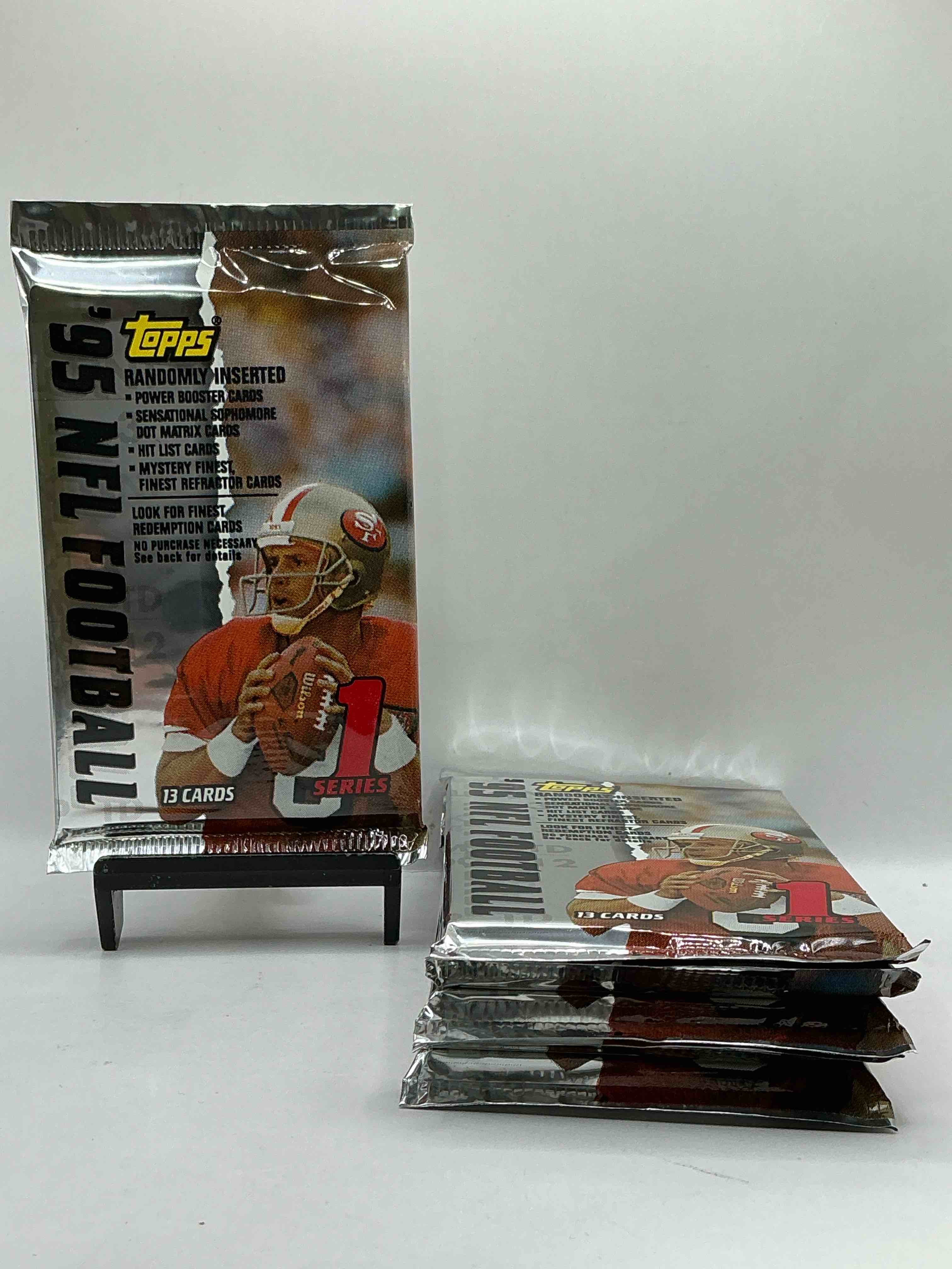1995 NFL Football! Topps Series 1 NFL Football… 13 Cards Per Pack! Look For Legends, Rookies & More! Also Look For Randomly Inserted Power Booster, Sensational Sophomore, Hit List Cards & More! 90’s Football!