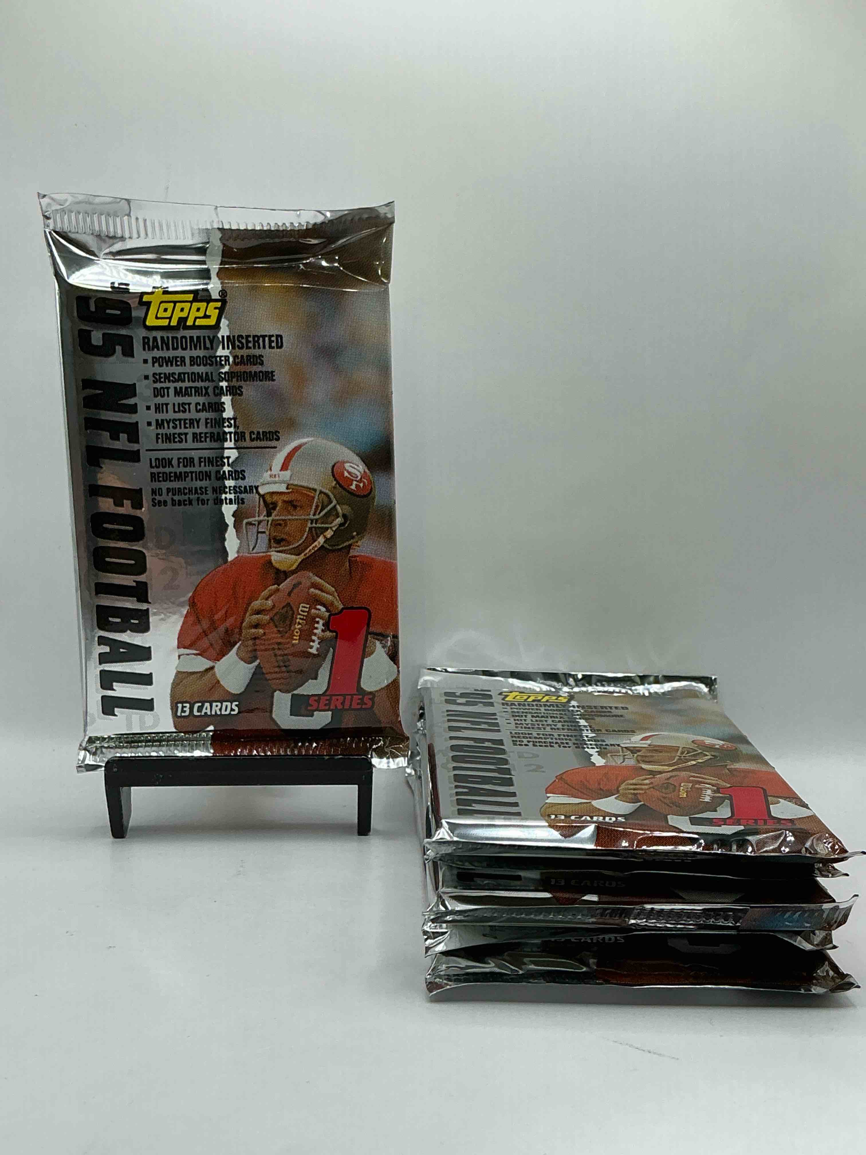 1995 NFL Football! Topps Series 1 NFL Football… 13 Cards Per Pack! Look For Legends, Rookies & More! Also Look For Randomly Inserted Power Booster, Sensational Sophomore, Hit List Cards & More! 90’s Football!