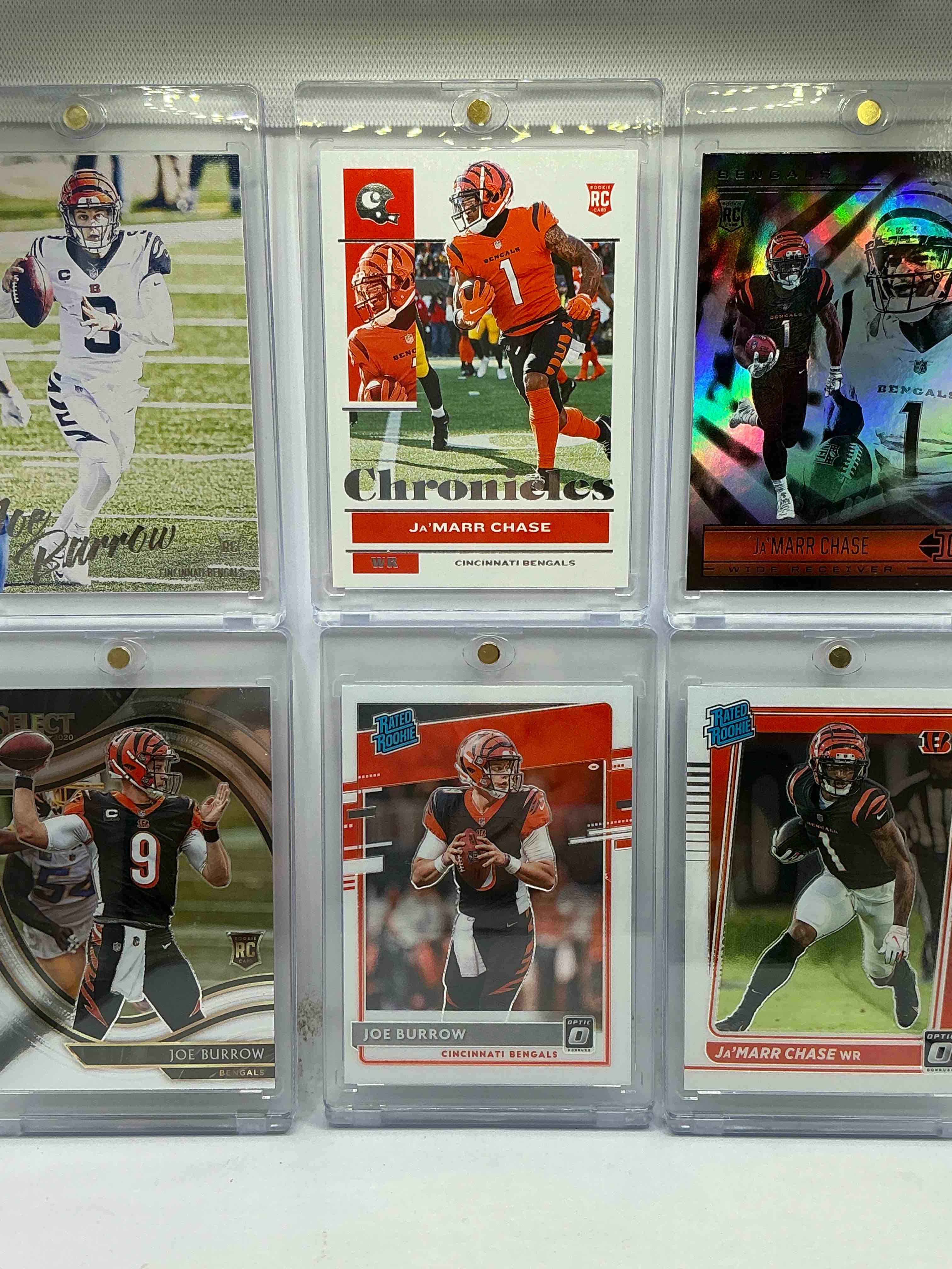 Bengals Bros! Ja’marr Chase & Joe Burrow Six Card Rookie Extravaganza! Optic Chase & Burrow Match, Illusions Chase Rookie, Chronicles Chase Rookie, Select Burrow Rookie & Panini Burrow Rookie! Insane Bengals Lot! WOW! The Perfect Gift For Cincy Fans!