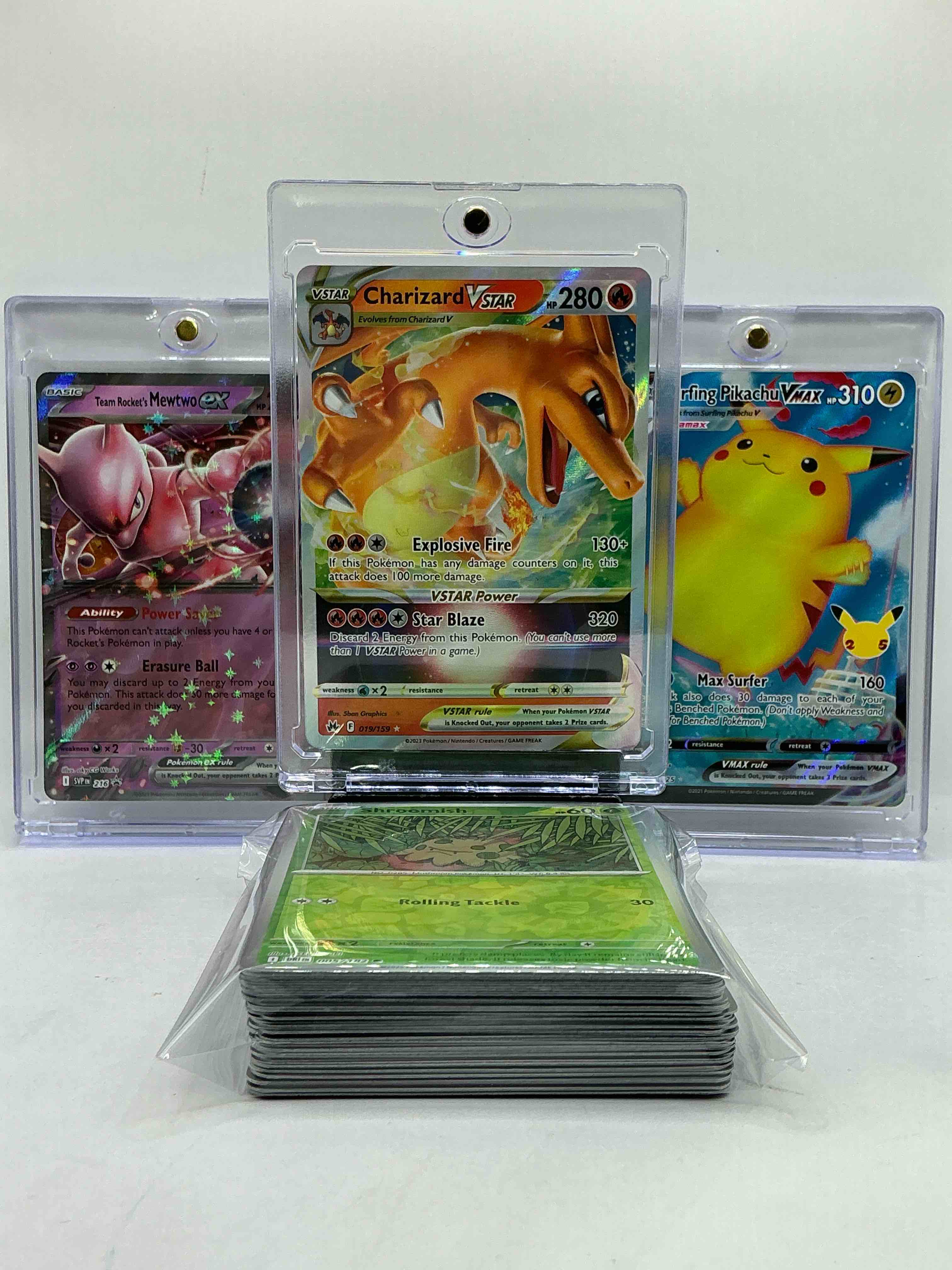Charizard VSTAR Holo, Mewtwo EX Holo, Surfing Pikachu Holo VMAX & MORE! Three Of The Most Collectible Pokemon Out There! WOW! This 59 Card Lot Includes Commons, Legends, Heroes, Monsters & More!
