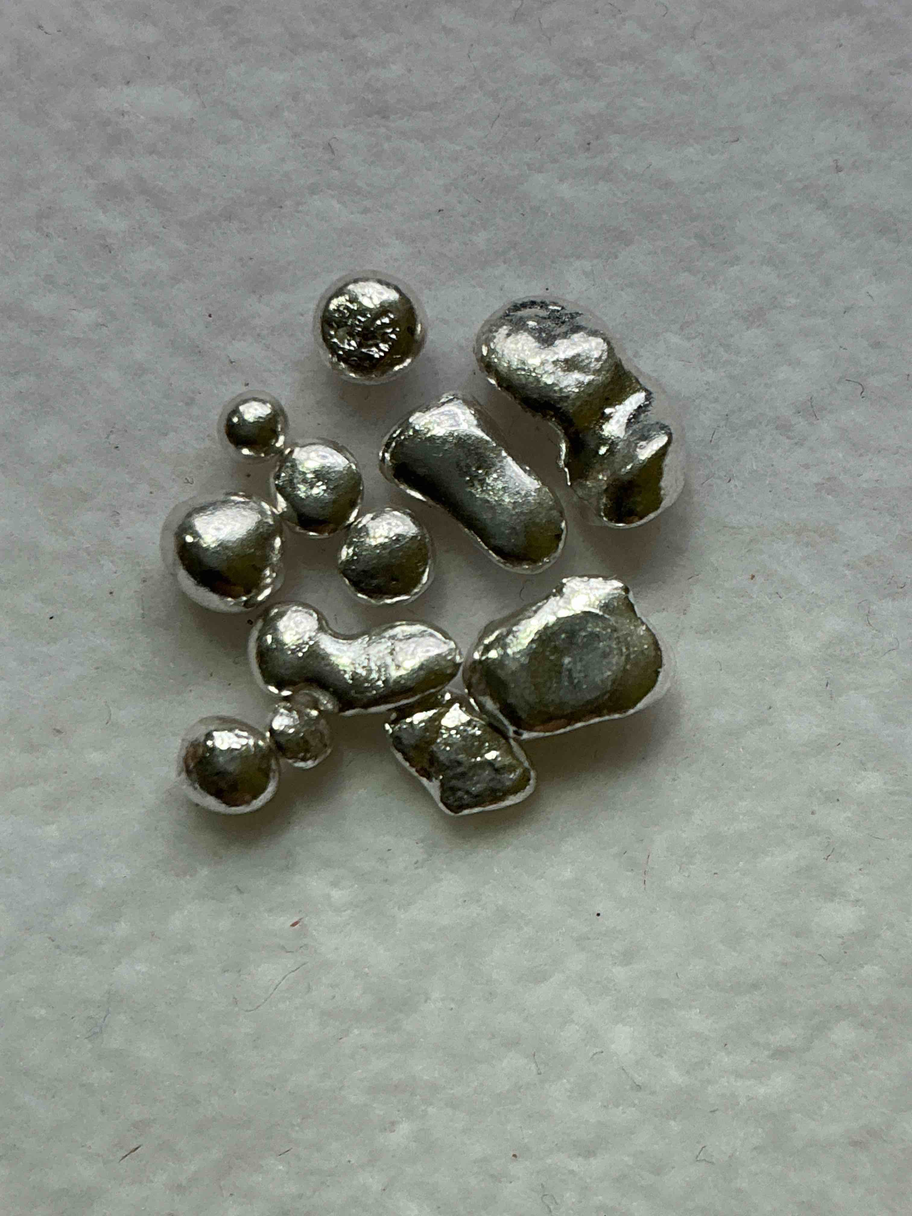 Silver Nuggets! .999 US Fine Silver, In Small Nugget Form! Total Weight Of All Nuggets In Lot Approximately 3 Grams, Bid Is Per Nugget! A Cool Way To Invest In Fine US Silver! Includes Collector Capsule!