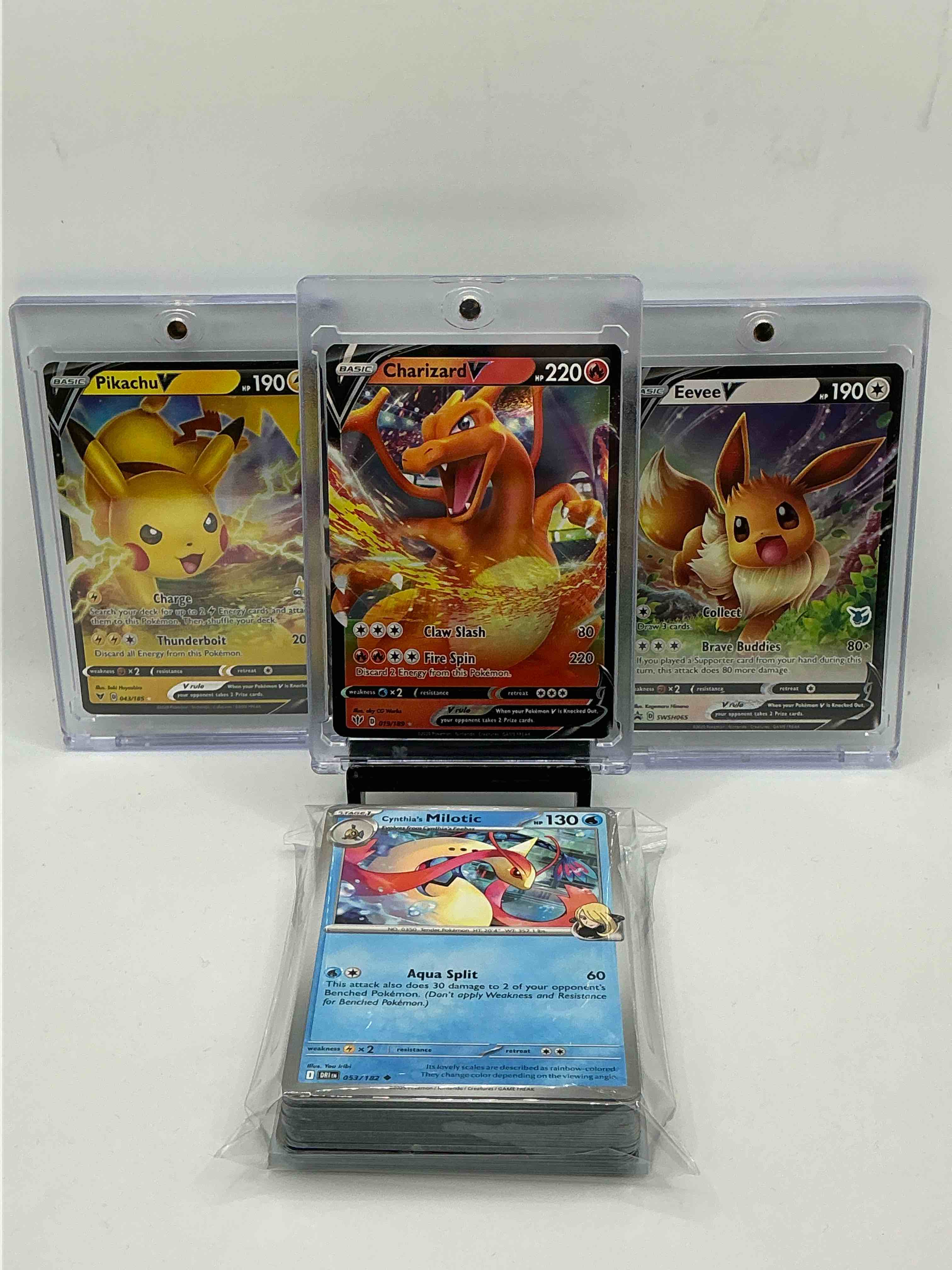 Pokémon Palooza! Orange Claw Splash Fire Spin Charizard V, Silver Holographic Brave Buddies Eevee V, Yellow Holographic Charge Thunderbolt Pikachu V! Along With A Combination Of 50 Pokémon Holos, Heroes & Commons!