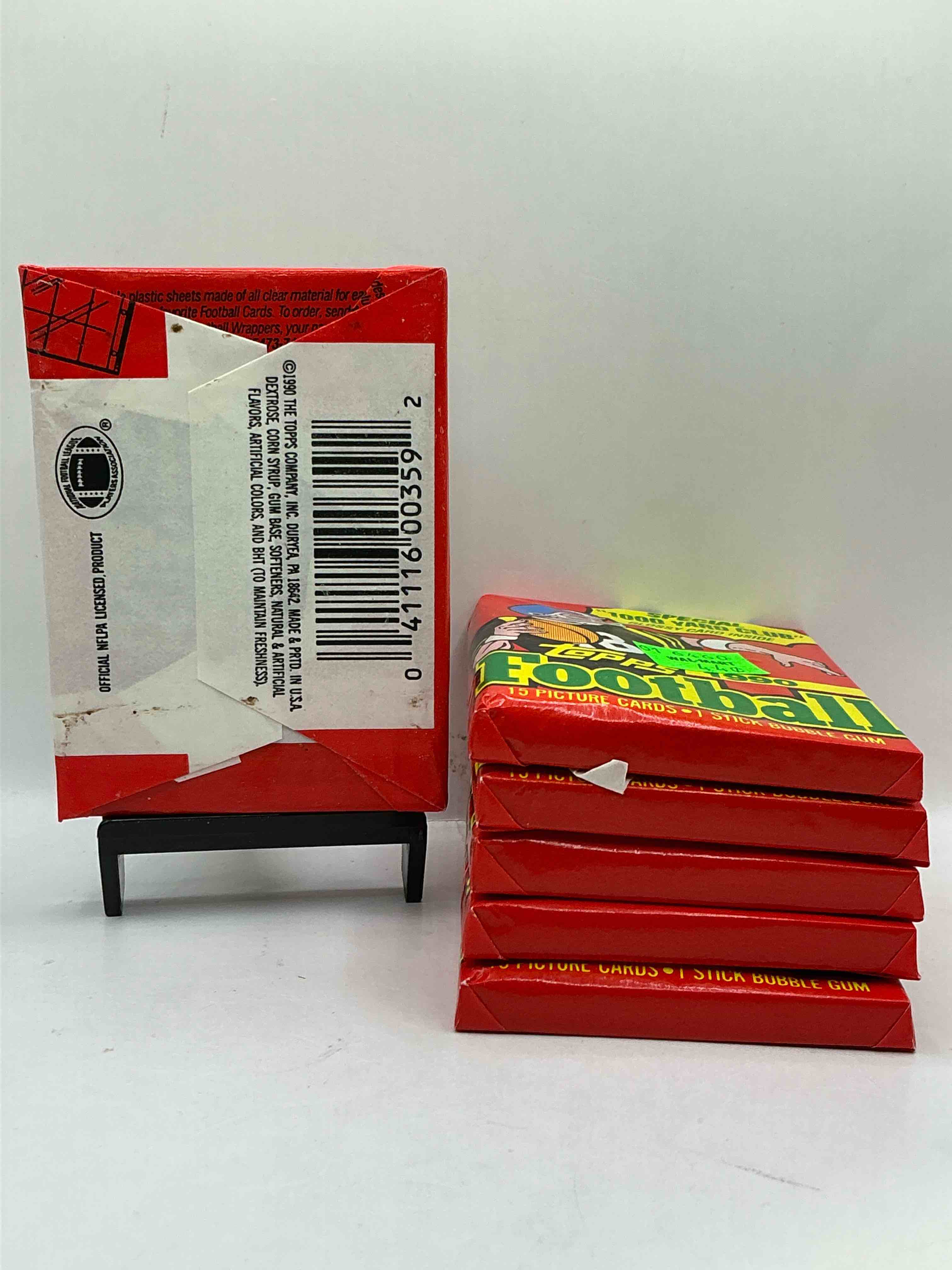 Condition photo showing New/Like New for The Last Year Of Football Wax! Joe Montana, Emmitt Smith & Barry Sanders!? 1990 Topps Football Unopened Sports Card Wax Pack, Direct From Original Retail Box! Getting Hard To Find! Search For Early Barry Sanders & Jerry Rice & So Much More!