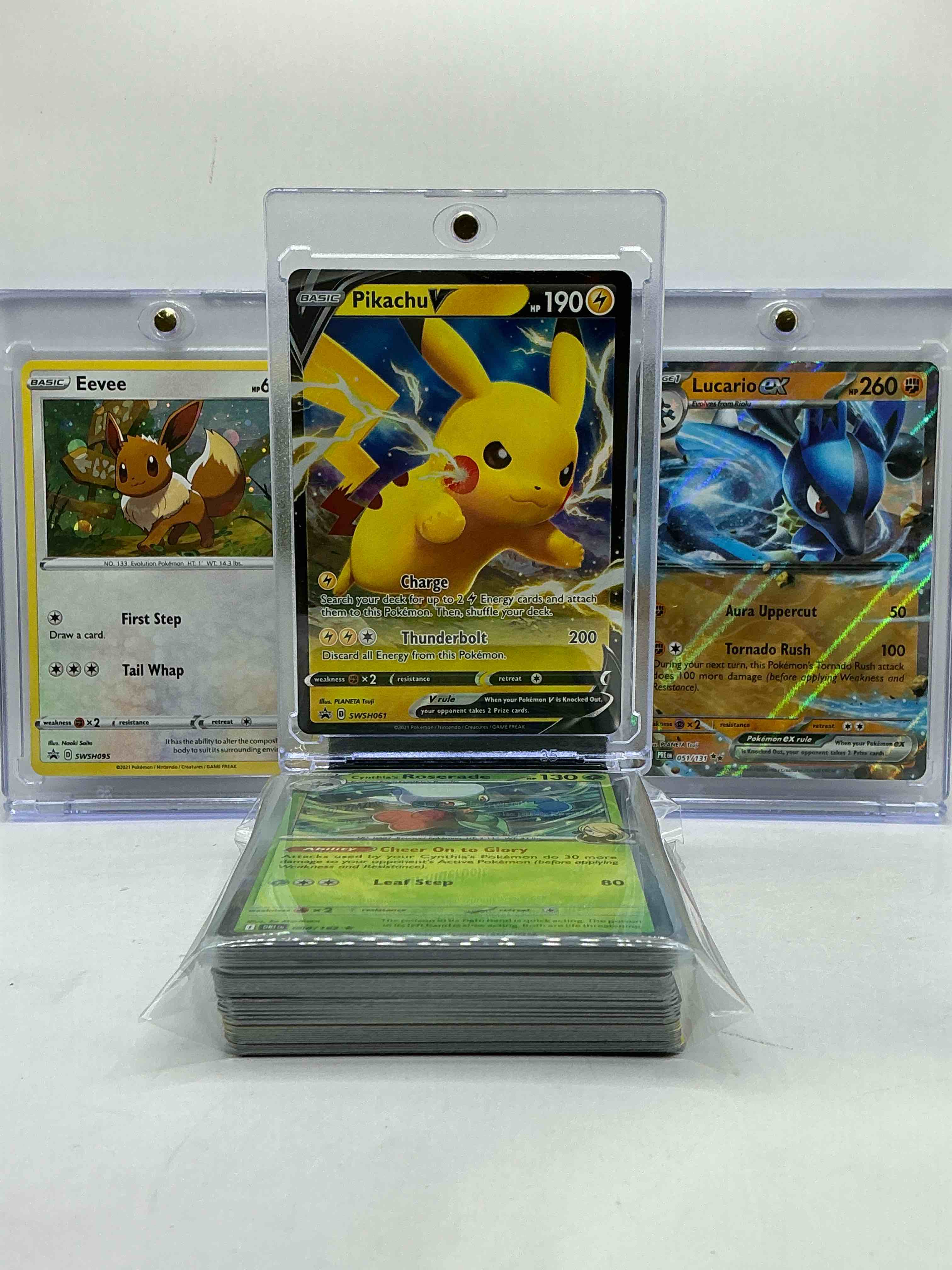 Pikachu V Holo, Lucario V Holo, Eevee & More! Insane Trio! What!? Pokémon Party! Collect & Invest In These Rare Cards! 50 Card Lot, Commons, Legends, Holos & More!