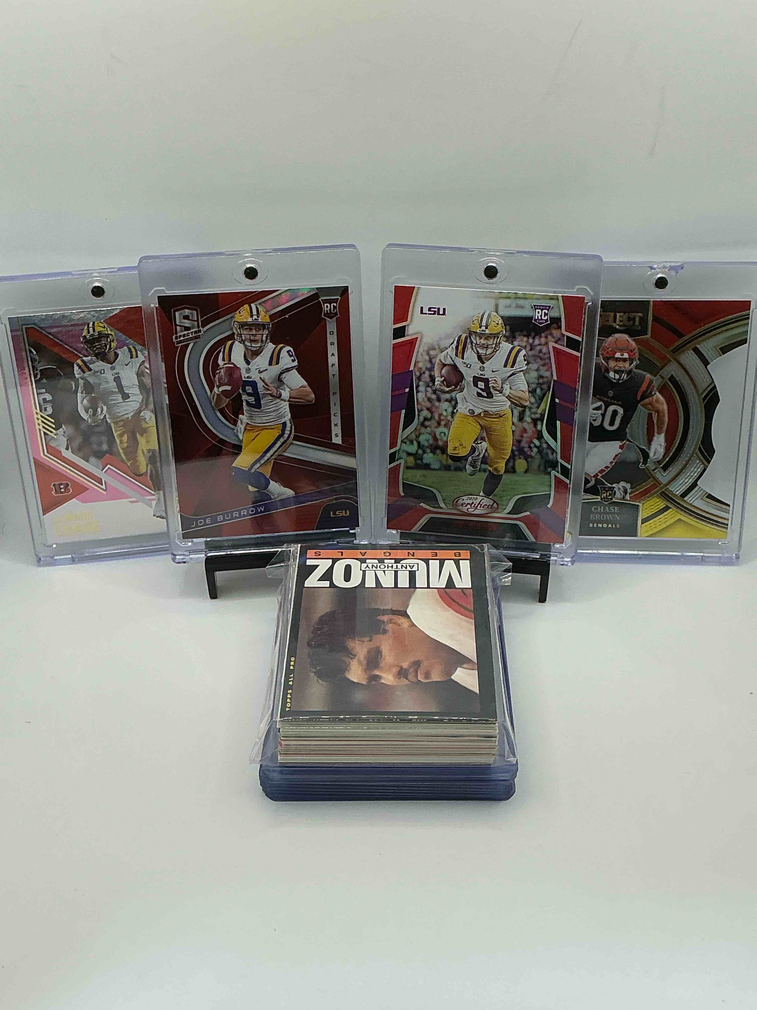 Bengals Bonanza! 2020 Red Spectra Draft Picks Rookie Joe Burrow, 2020 Certified Red Rookie Joe Burrow, 2021 Donruss Elite Orange & Pink Parallel Rookie Ja’marr Chase, 2023 Prizm Red Die-Cut Rookie Chase Brown! Along With 50 Other Bengals Heroes, Rookies & Commons!
