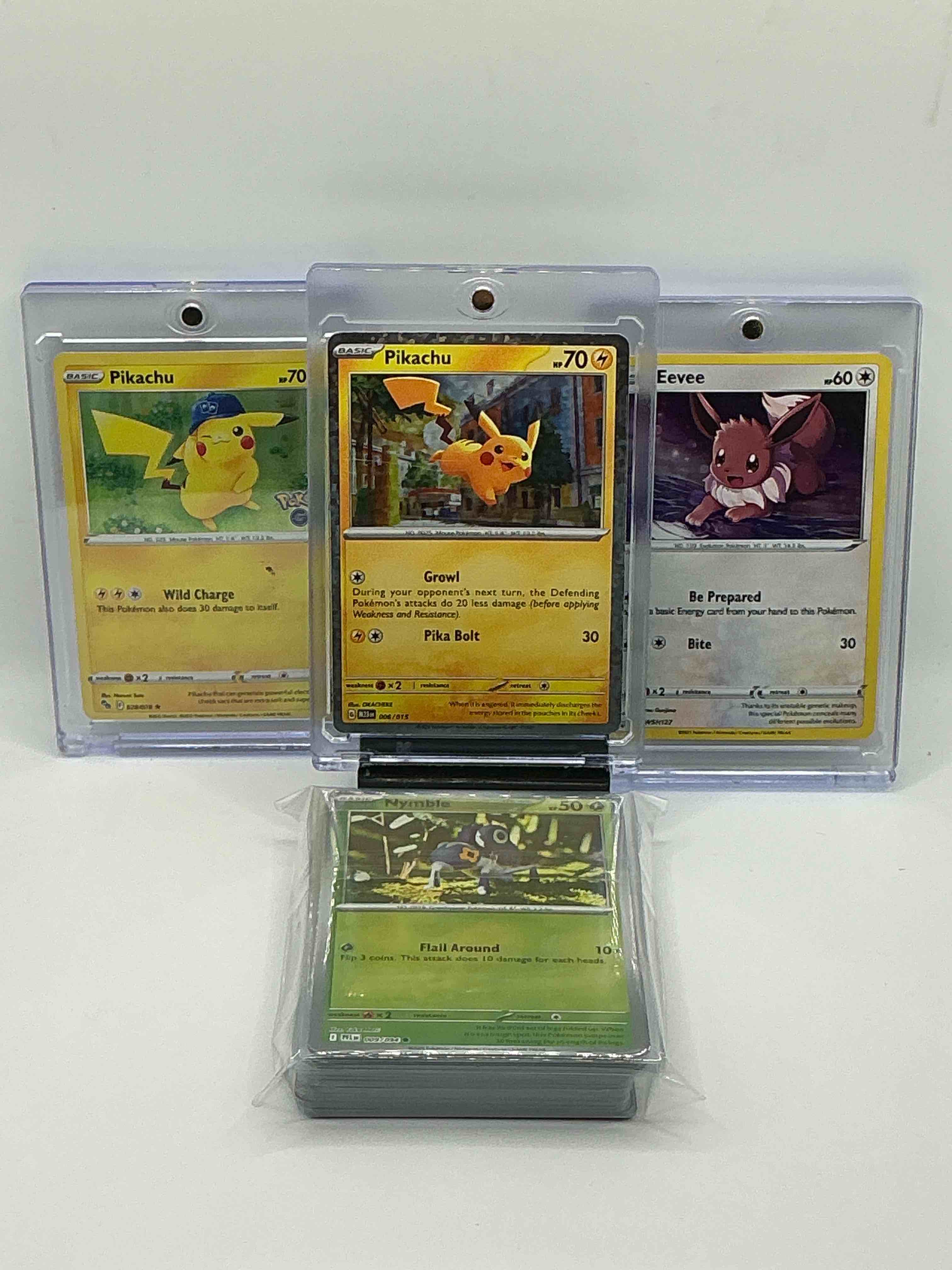 Pokémon Palooza! Yellow Holographic Growl Pika Bolt Pikachu, Yellow Reflective Wild Charge Pikachu, Yellow and Purple Sparkle Be Prepared Bite Eevee! Along with 50 Other Pokemon Holos, Heroes & Commons!