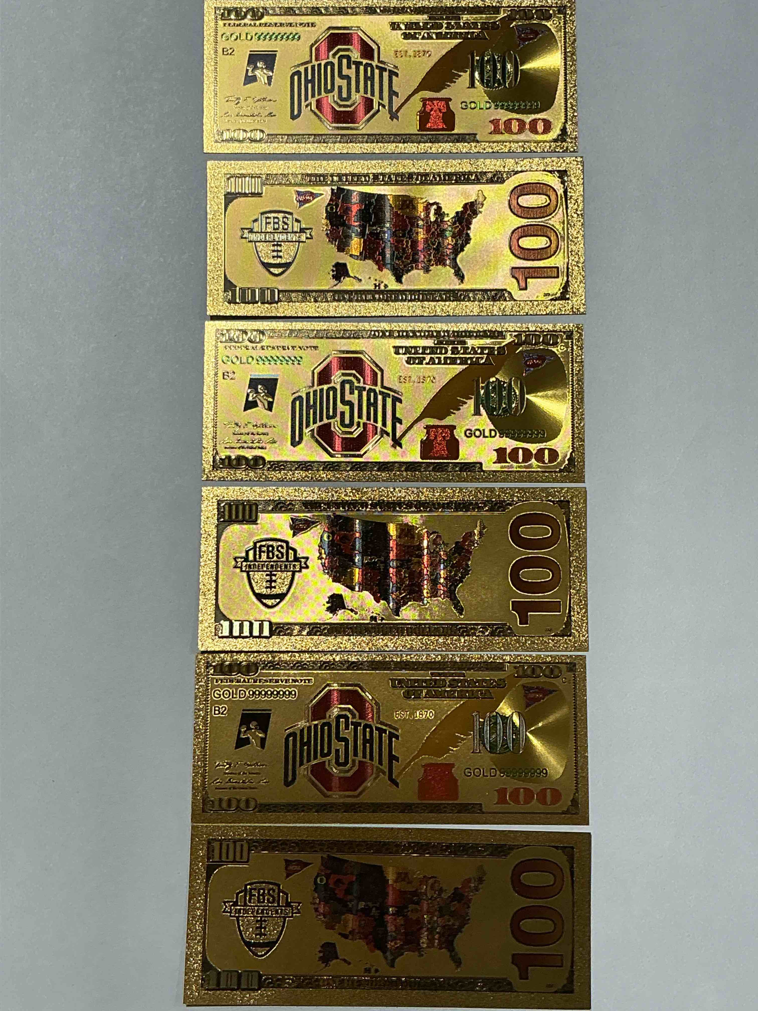 Ohio State University Collectible Memorabilia! Super Cool, Gold In Color 100 Dollar Commemorative Ohio State University Bill! Cool Designs On Front & Back Of Bill! OSU Fans Rejoice, Cool Memorabilia! Plastic Bills With Cool Designs! 