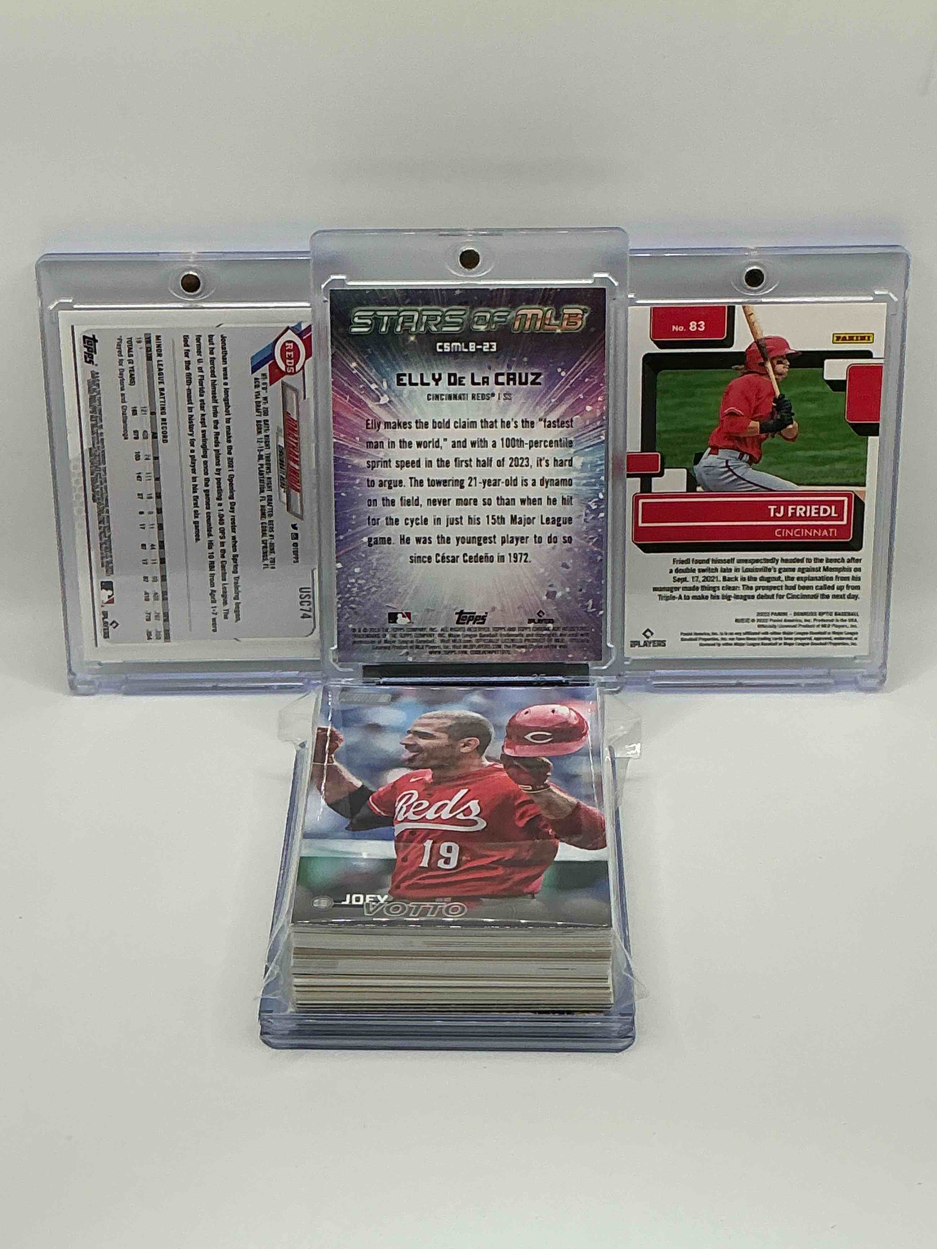 Condition photo showing New/Like New for Reds Rookie Rambunctiousness! 2024 Topps Chrome Stars Of MLB Purple Haze Rookie Elly De La Cruz, 2021 Topps Chrome Pink Burst Rookie Jonathan India, 2022 Donruss Optic Rated Rookie TJ Friedl! Along With 50 Other Reds Legends, Heroes, Rookies & Commons!