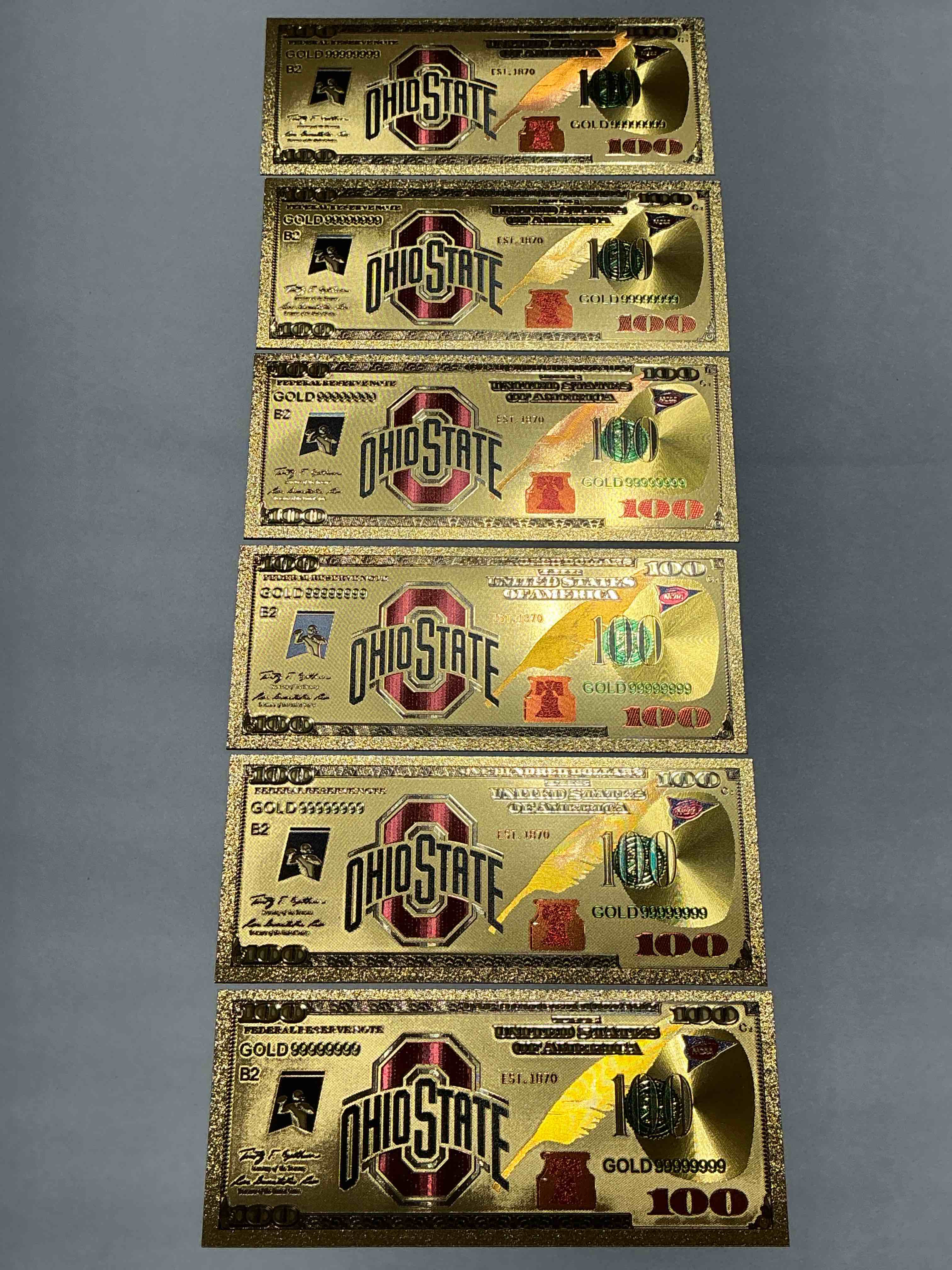 Ohio State University Collectible Memorabilia! Super Cool, Gold In Color 100 Dollar Commemorative Ohio State University Bill! Cool Designs On Front & Back Of Bill! OSU Fans Rejoice, Cool Memorabilia! Plastic Bills With Cool Designs! 