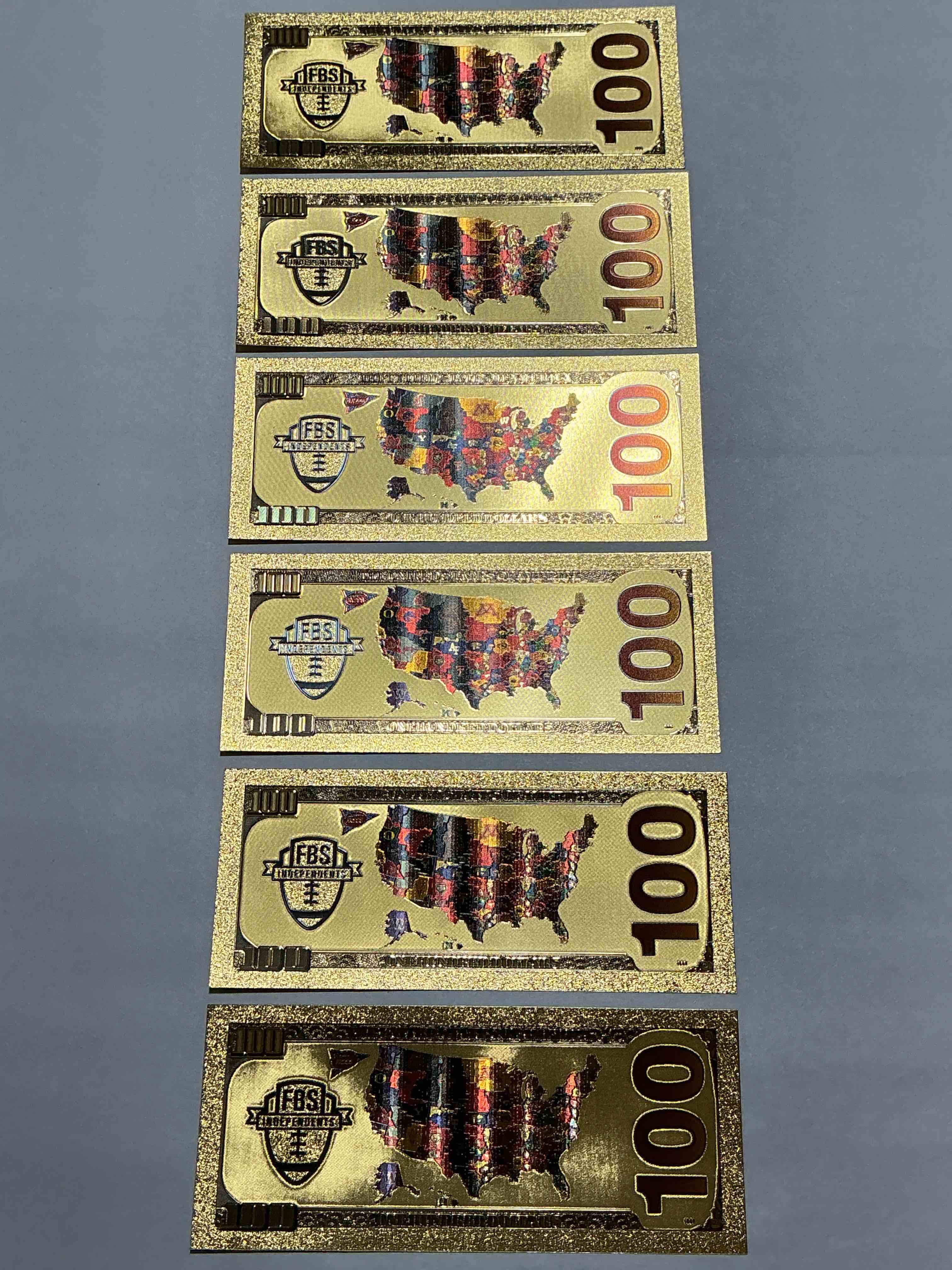 Condition photo showing New/Like New for Ohio State University Collectible Memorabilia! Super Cool, Gold In Color 100 Dollar Commemorative Ohio State University Bill! Cool Designs On Front & Back Of Bill! OSU Fans Rejoice, Cool Memorabilia! Plastic Bills With Cool Designs! 