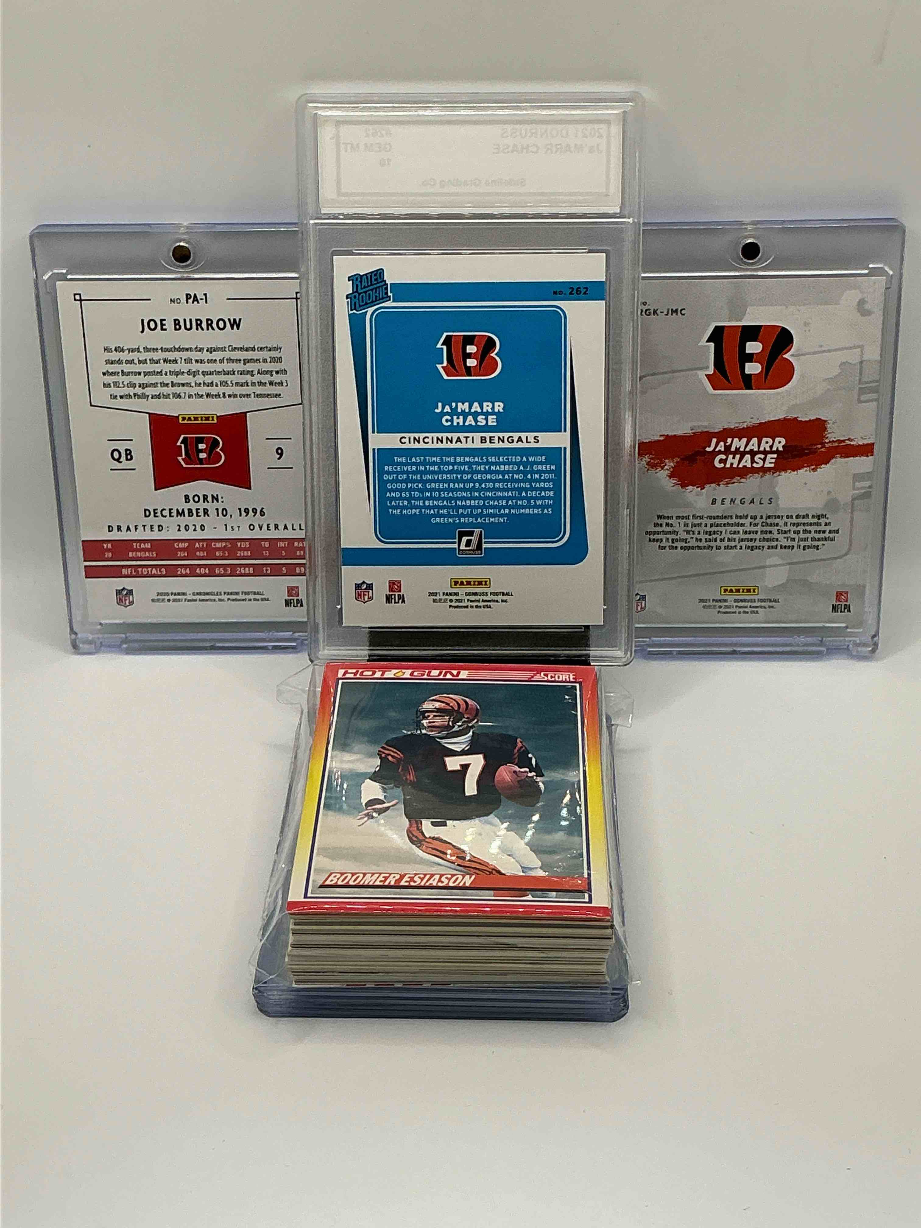 Condition photo showing New/Like New for Bengals Bonanza! 2021 Donruss Orange And White Rated Rookie Ja’marr Chase Rated A Gem Mint 10, 2020 Chronicles Orange And White Rookie Joe Burrow, 2021 Donruss Gridiron Kings Orange And White Explosion Rookie Ja’marr Chase! Along With 50 Other Bengals Legends, Heroes, Rookies & Commons!