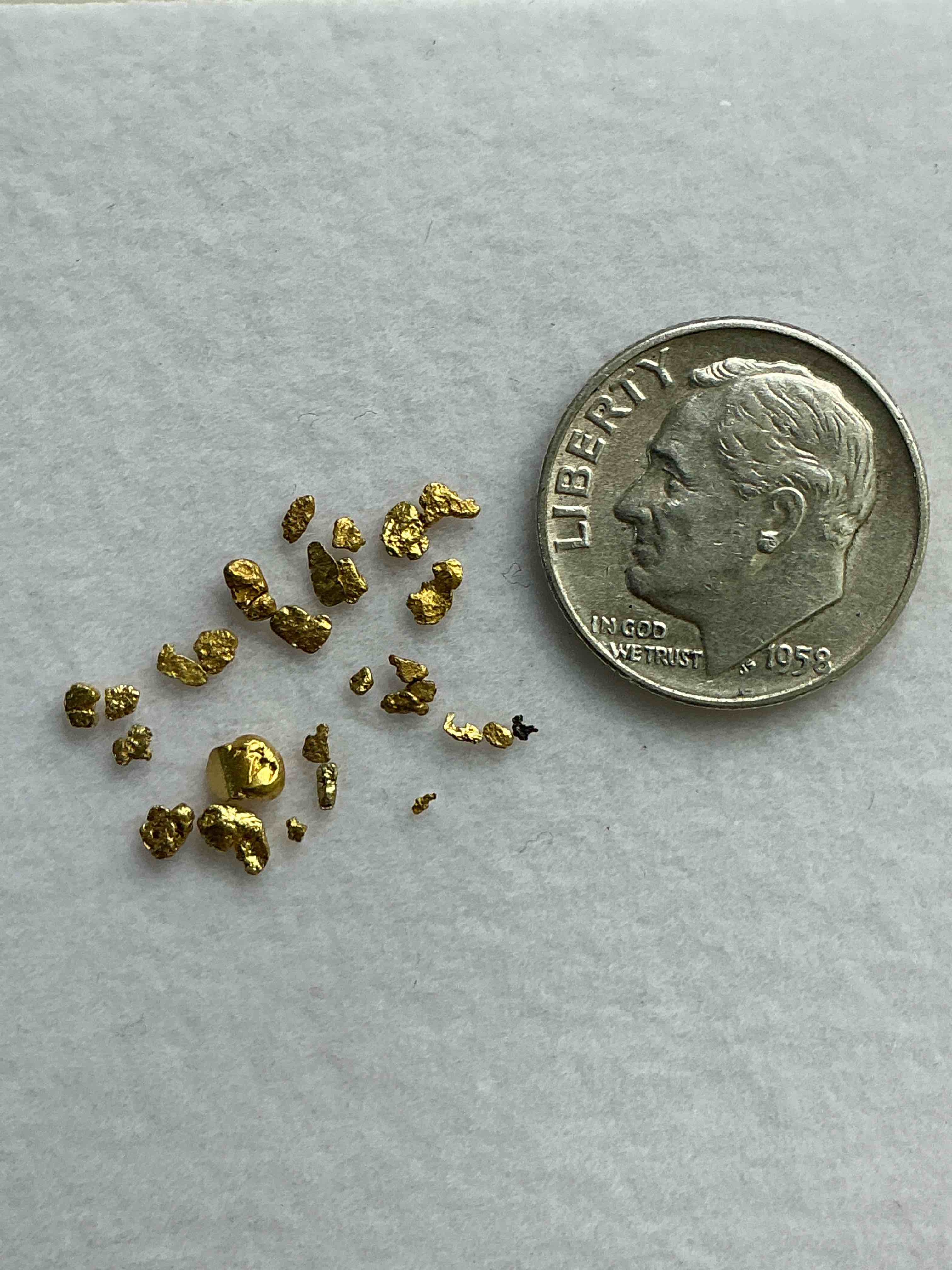 Condition photo showing New/Like New for Gold Nuggets, Authentic! Wow! These Are Genuine Pure Gold Nuggets Prospected From North Carolina. Approximately 0.4 GM In Total Size/Weight For All Nuggets. This Type Of Gold In Nuggets Form That Has Not Been Processed Is Extremely Hard To Find & Is Much More Rare Than Processed Gold In Any Form. U.S. Dime Shown In Image Is For Visual Size Reference Only (Not Included). Own Incredibly Cool Pieces Of Gold & An Awesome Investment In Fine U.S. Gold Precious Metal! Every Gold Nugget Is "One Of A Kind!"