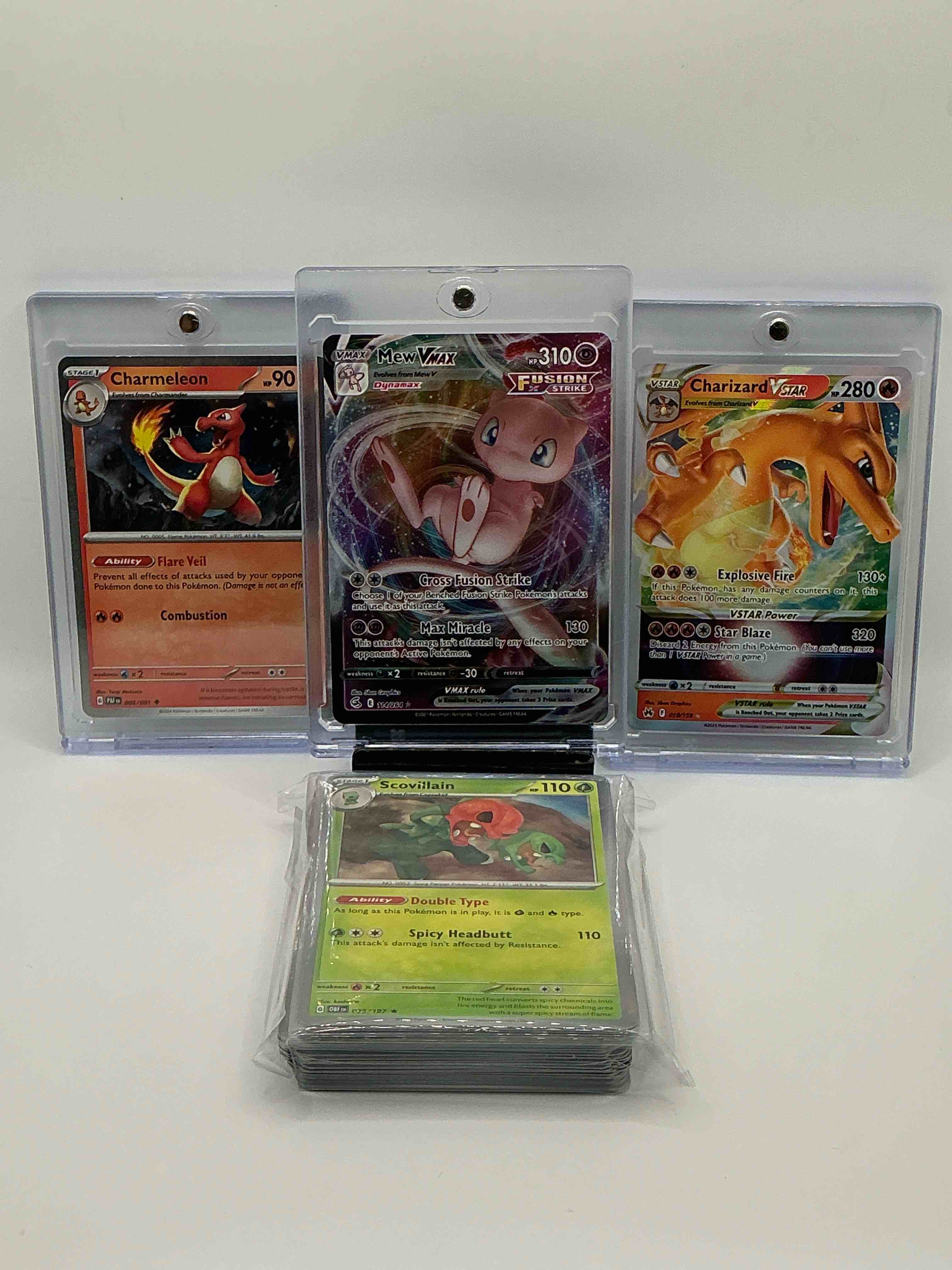 Purple Vortex Holographic Cross Fusion Strike Max Miracle Mew Vmax, Orange Silver Sparkle Flare Veil Combustion Charmeleon, Turquoise Cycle Silver Holographic Explosive Fire Star Blaze Charizard V Star! Along With 50 Other Pokémon Holos, Heroes, Legends & Commons!  