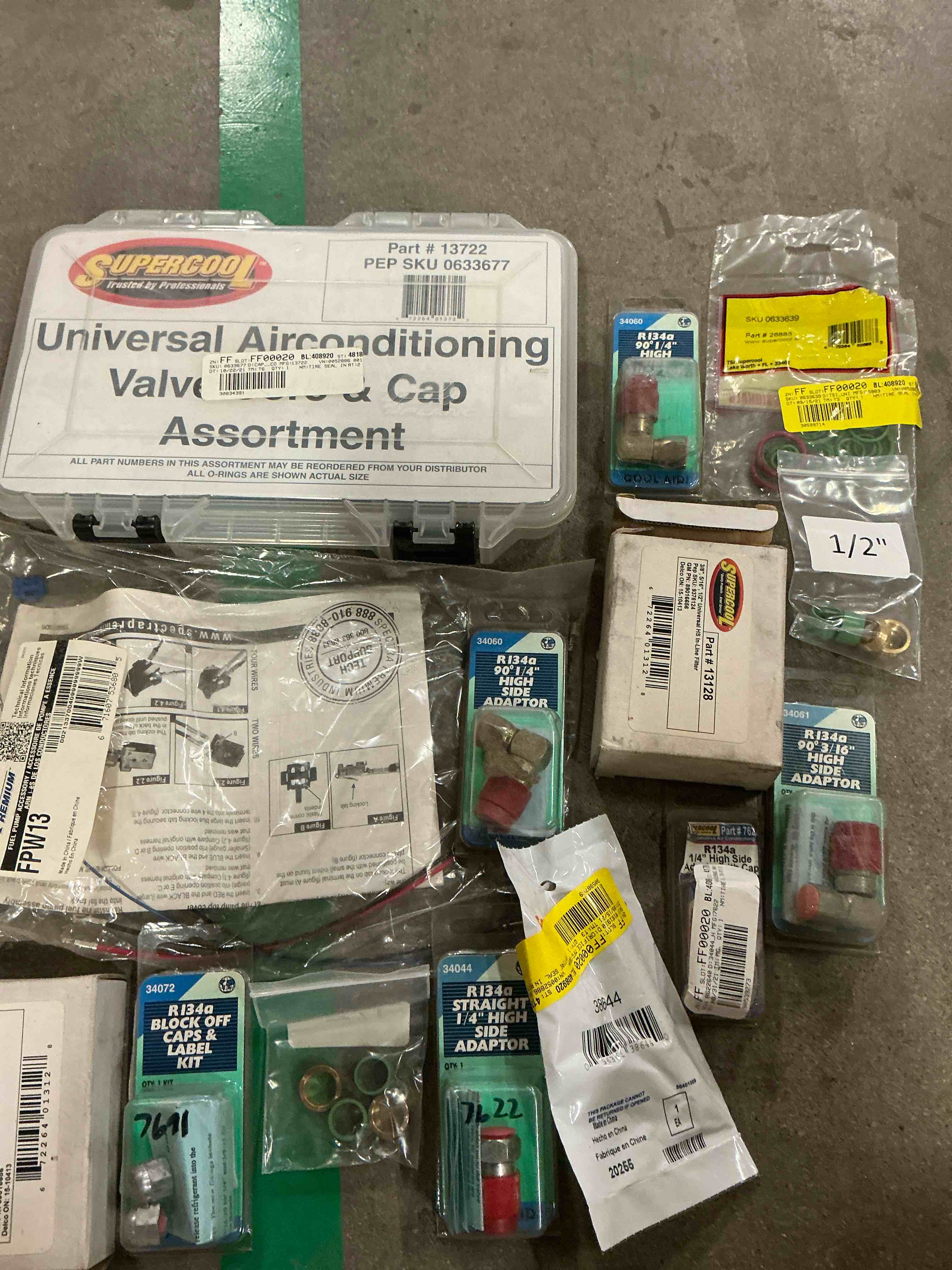 Assorted of car parts included Ri34a block off caps & label kit/ Supercool and more 