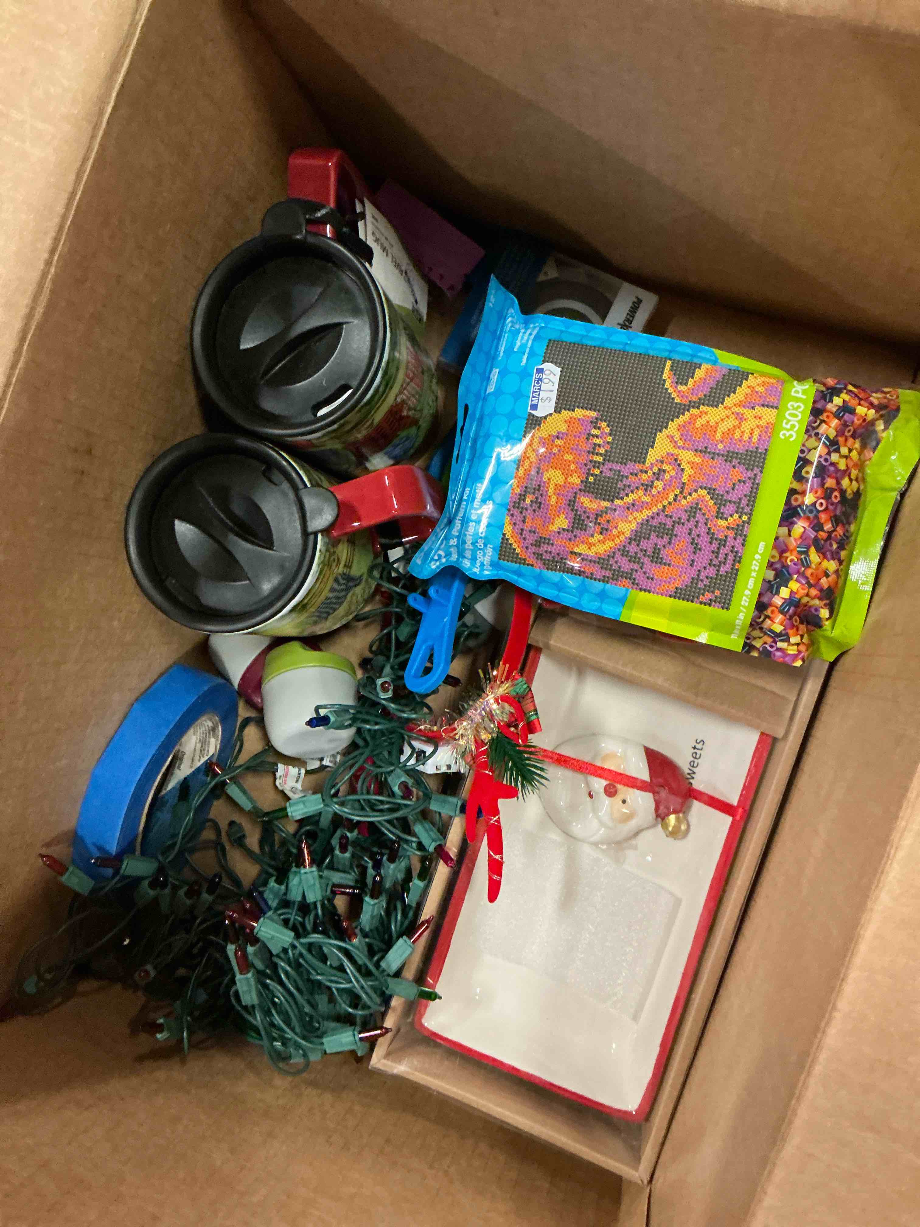 Assortment of variety of products includes: Christmas lights/toys and more 