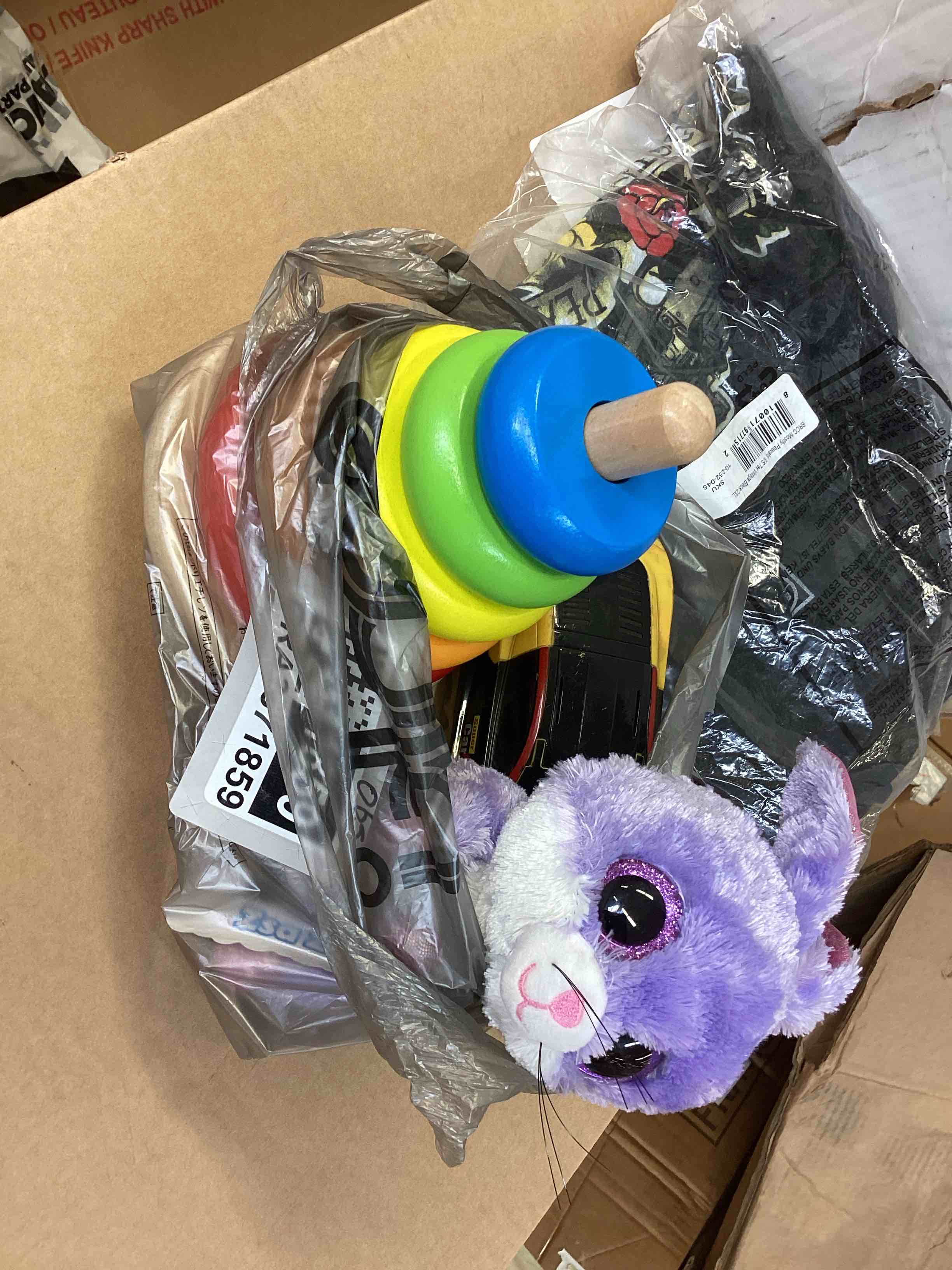 Assorted of toys, wooden rings, stuffed rabbit, racing car (3 pieces) 