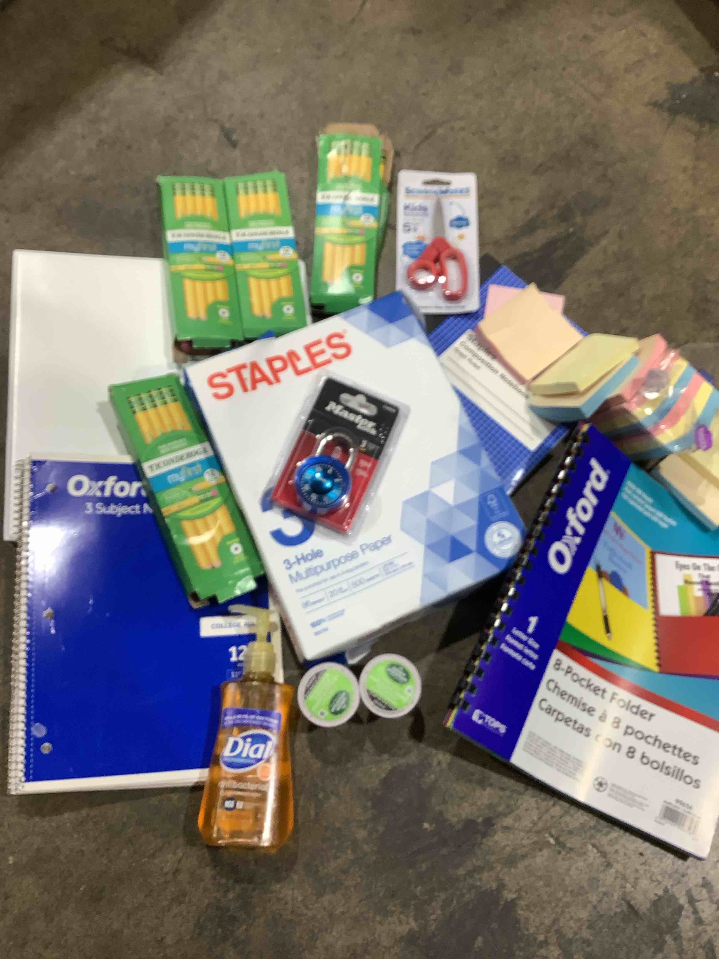 Assortment of office and personal supplies: master lock, eight pocket folder, kid, scissors, my first pencils, three hole multipurpose paper and much more