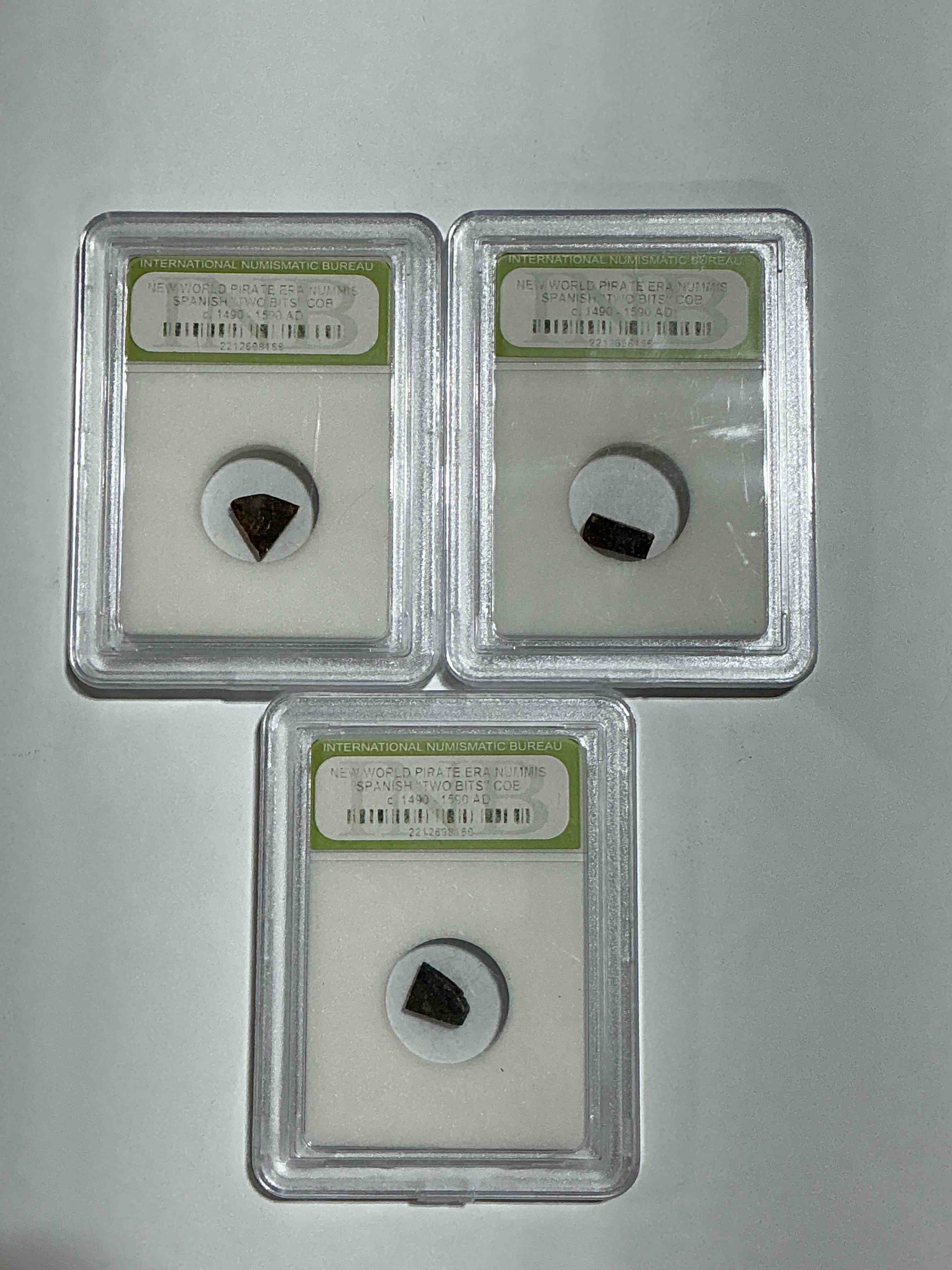 Pirate Era Spanish "Two Bits" Coin, Authentic! Circa 1490-1590, 400 To 500 Years Old! These Copper "Two Bit" Pieces Were Hand Cut Off Larger Coins In The Golden Pirate Age To Create Smaller Denominations. A Genuine Piece Of Cool History! A Great Authentic Pirate Era Collectible Encased In INB Slab!