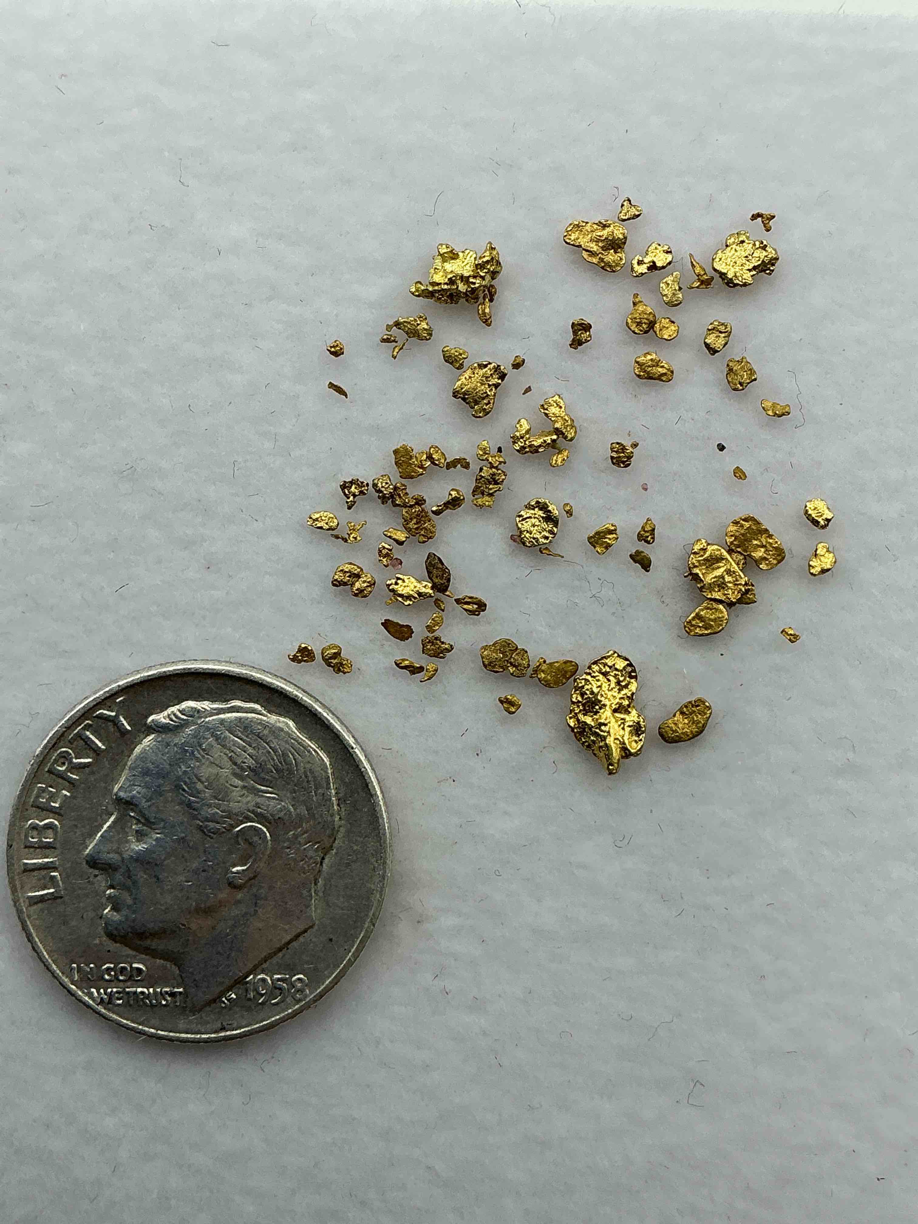 Condition photo showing New/Like New for Gold Nuggets, Authentic! Wow! These Are Genuine Pure Gold Nuggets Prospected From North Carolina. Approximately 0.4 GM In Total Size/Weight For All Nuggets. This Type Of Gold In Nuggets Form That Has Not Been Processed Is Extremely Hard To Find & Is Much More Rare Than Processed Gold In Any Form. U.S. Dime Shown In Image Is For Visual Size Reference Only (Not Included). Own Incredibly Cool Pieces Of Gold & An Awesome Investment In Fine U.S. Gold Precious Metal! Every Gold Nugget Is "One Of A Kind!"