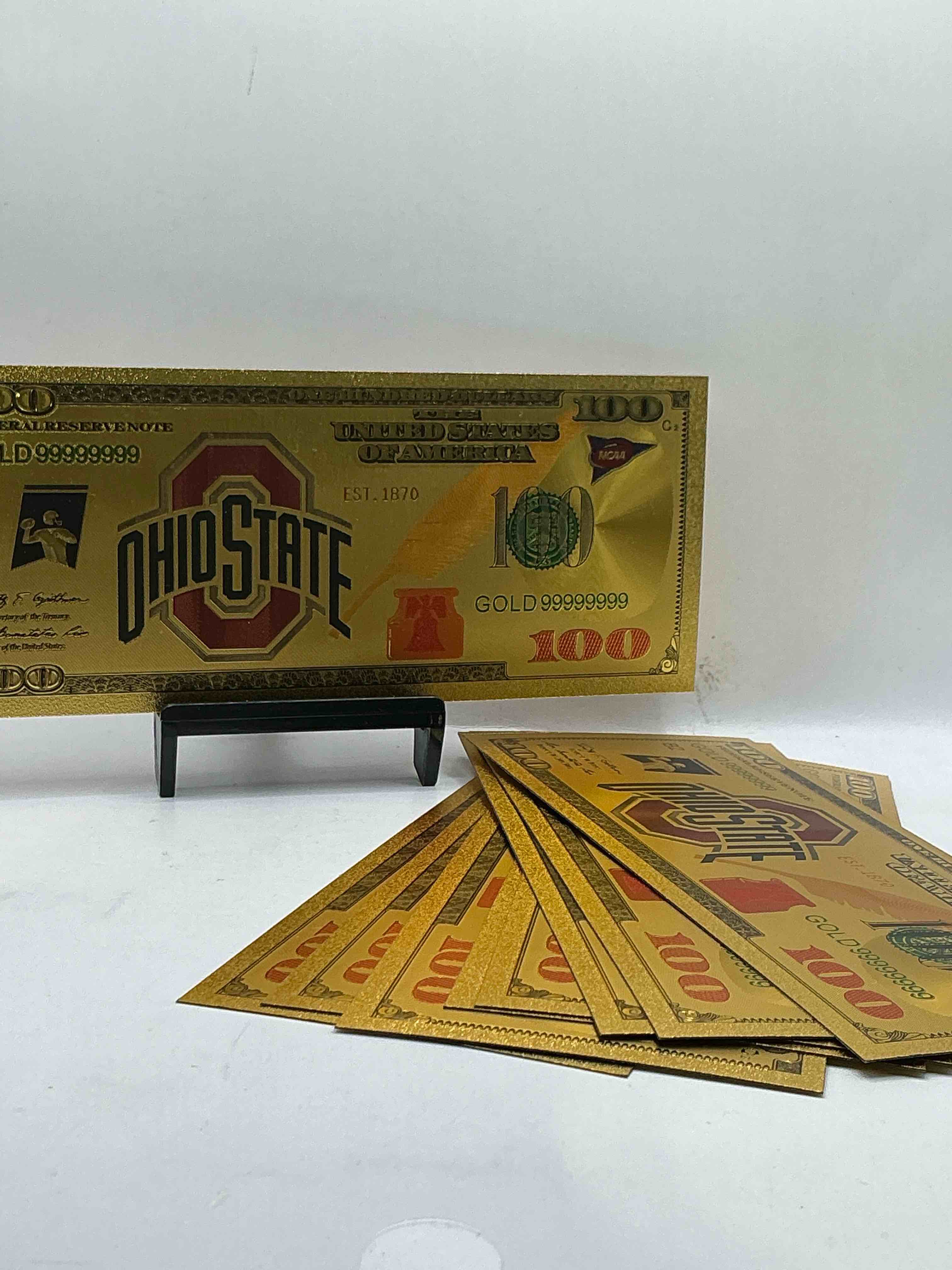 Ohio State University Collectible Memorabilia! Super Cool, Gold In Color 100 Dollar Commemorative Ohio State University Bill! Cool Designs On Front & Back Of Bill! OSU Fans Rejoice, Cool Memorabilia! Plastic Bills With Cool Designs! 