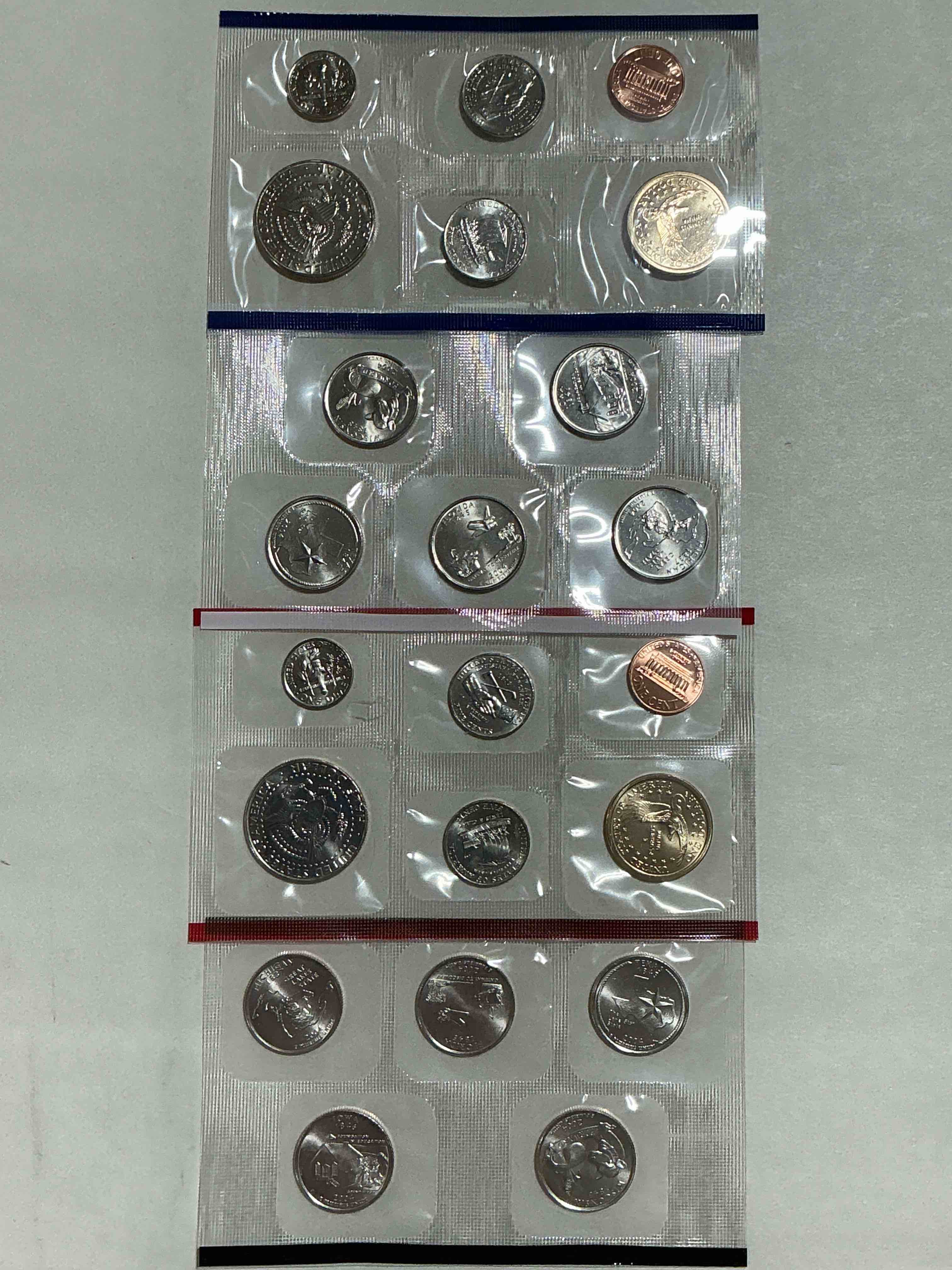 Condition photo showing New/Like New for 2004 Uncirculated Mint Coins! 22 Coin Mint Coins With State Quarters! Half Dollars, One Dollar Coins, Quarters, Nickels, Dimes & Pennies! 22 Coin Uncirculated Mint Coins! 