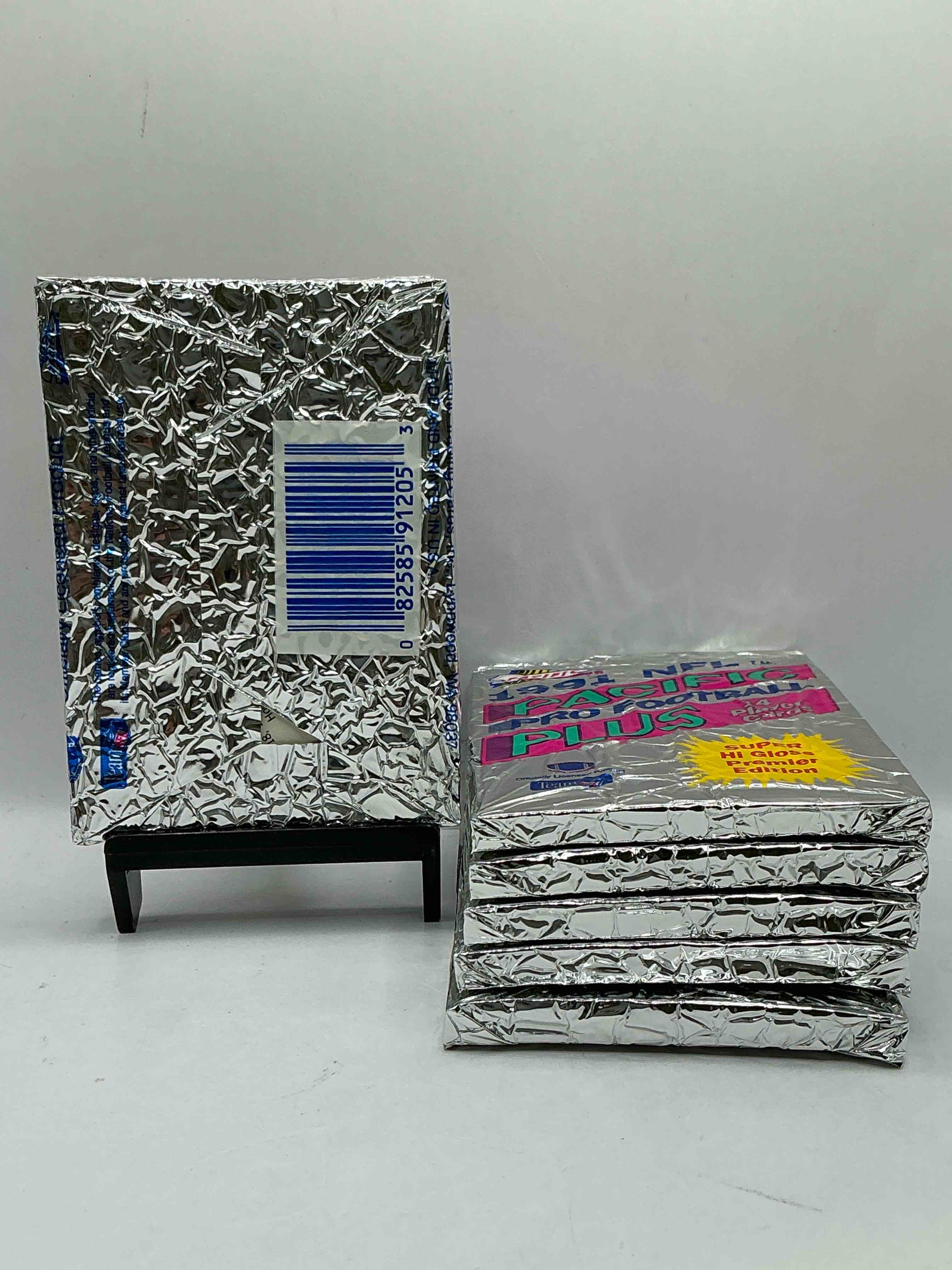 Condition photo showing New/Like New for 1991 Pacific Football, Something You Hardly Ever See! Pacific Footbell Sealed Card Pack, Direct From Original Retail Case. Search For Brett Favre Rookie, Barry Sanders, Jerry Rice & So Much More! Hard To Find!