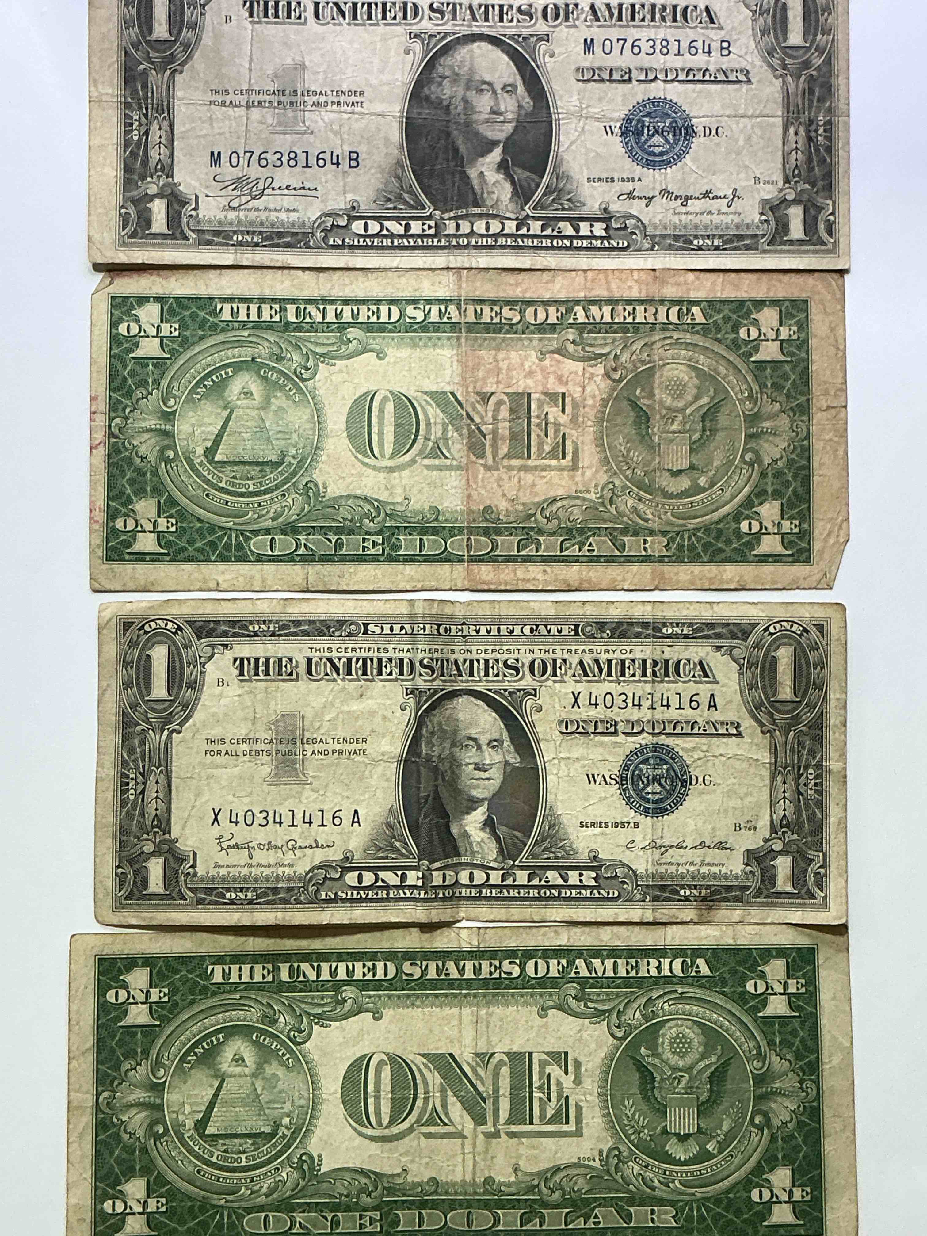 Condition photo showing Good Condition for 1957 & 1935 Silver Certificates! Did You Know That Prior To 1964 One Dollar U.S. Paper Money Was Actually Redeemable For Silver Dollars?! Wow How Times Have Changed! Silver Certificates Were Produced From 1878 To 1964 & Are Still Considered Legal Tender At Face Value. Here Are Gorgeous, Circulated 1935 & 1957 U.S. One Dollar Silver Certificate, With Highly Collectible "Blue Seal!* Own An Awesome Piece Of History!