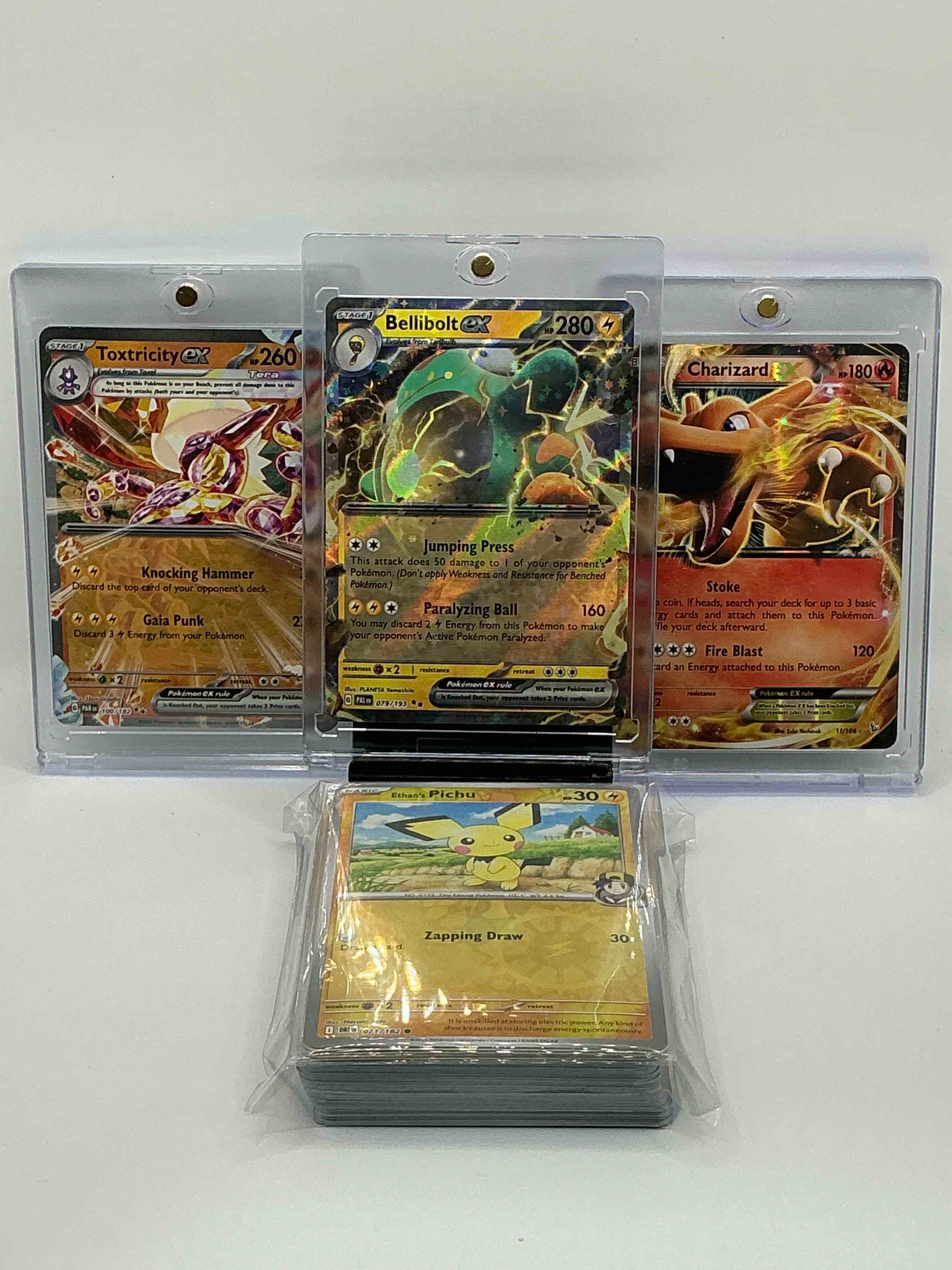 pokémon palooza! silver & yellow shimmer jumping press paralyzing ball bellibolt ex, silver swirl knocking hammer gaia punk toxtricity ex, gold & orange flame stoke fire blast charizard ex! along with 50 other pokémon heroes, holos, legends & commons!