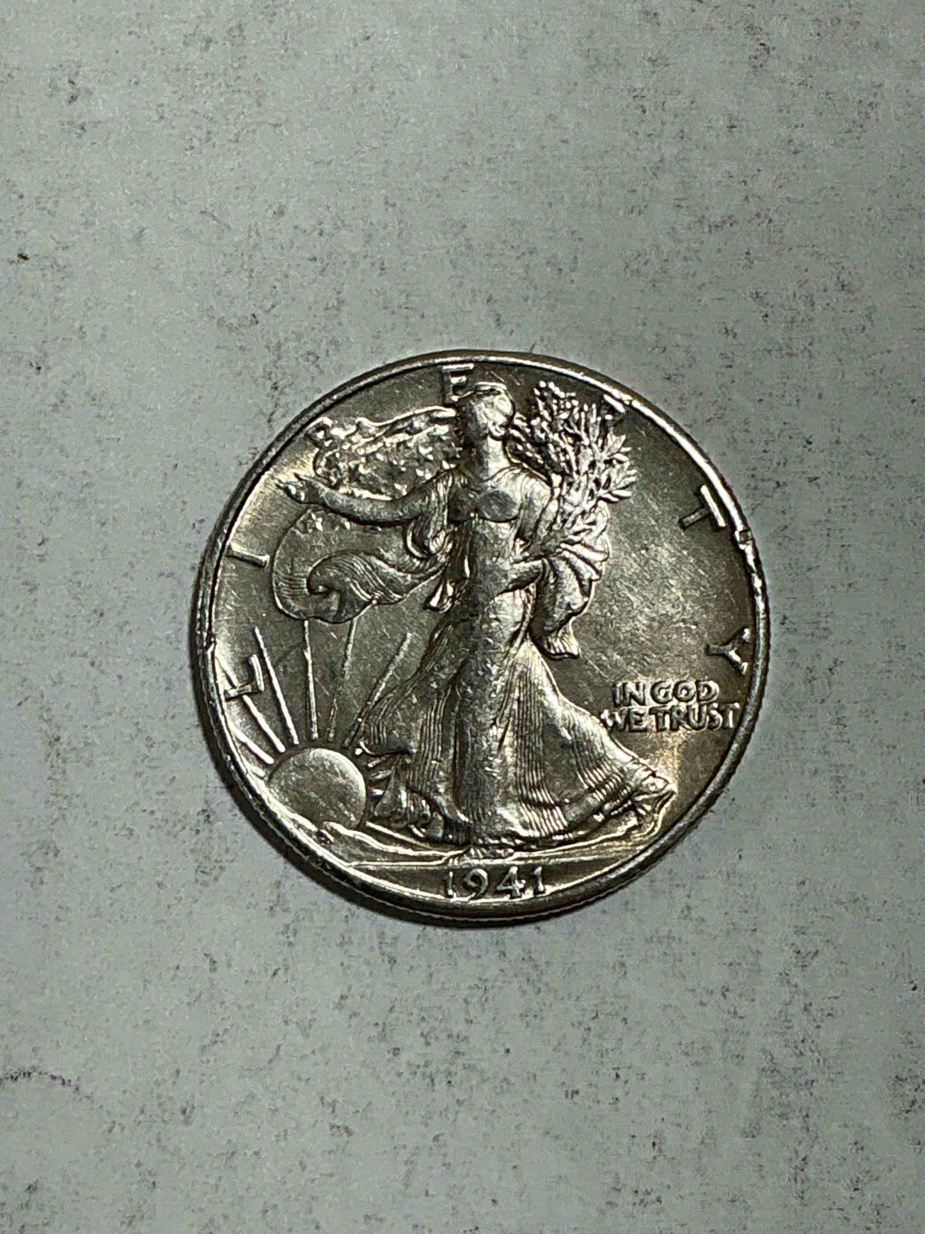 World War II Era Silver! Antique U.S. Silver! Liberty Walking Silver Fine U.S. Silver Half Dollar! This Striking Half Dollars Were Minted From 1916-1947 & Have Become Some Of The Most Collectible Coins In History! Here Is A Striking Uncirculated Example From 1941! Liberty Walking Coins Are 90% Fine U.S. Silver, A Great Investment In Precious Metal!