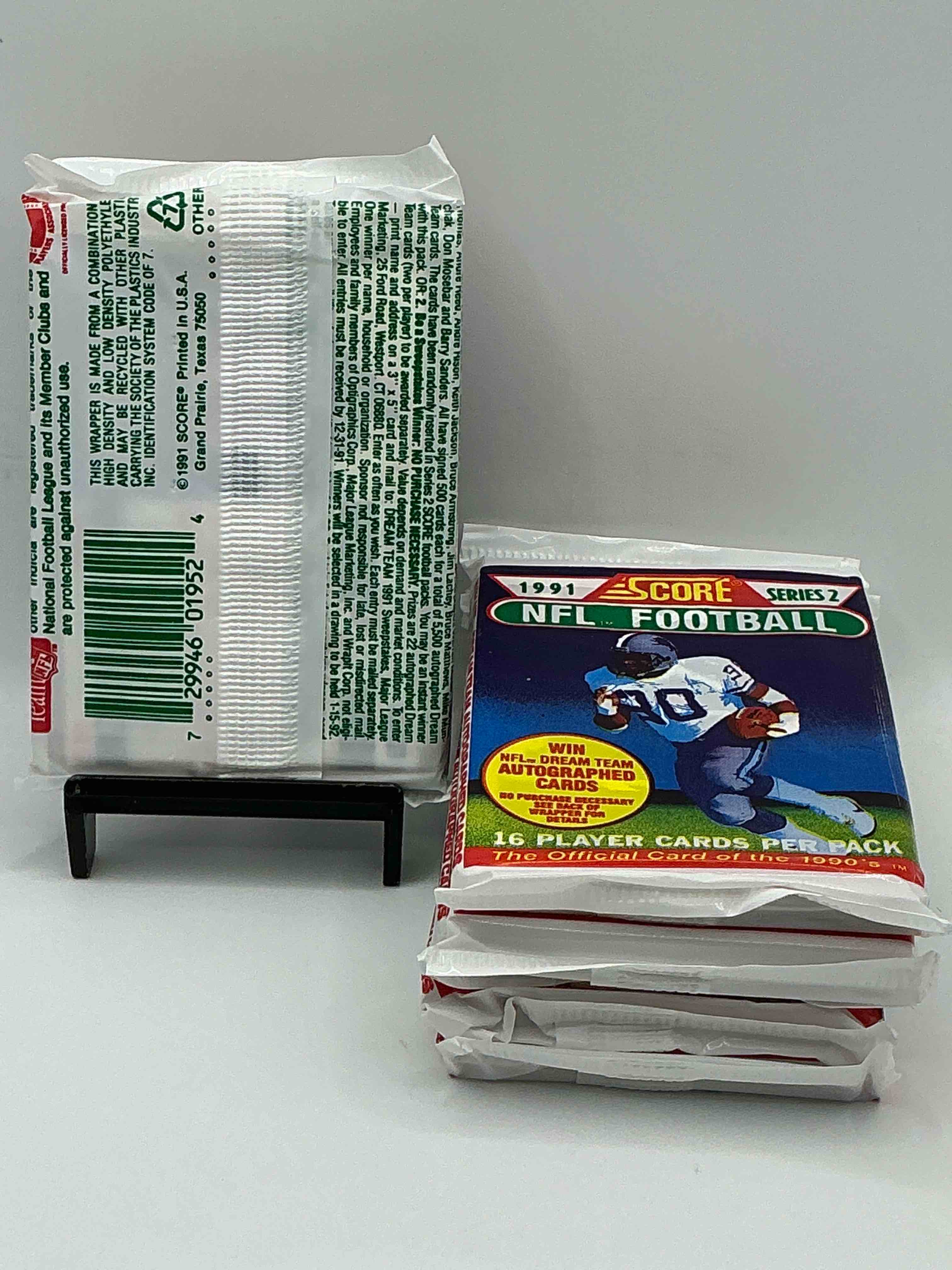 Condition photo showing New/Like New for 1991 NFL Score Football Sealed Card Packs Series II, Direct From Original Retail Case! These Cards Are Sought After By Collectors For Their Awesome, Nostalgic Look. Search For Brett Favre Rookie, Early Jerry Rice, Early Emmit Smith, Joe Montana & So Much More!