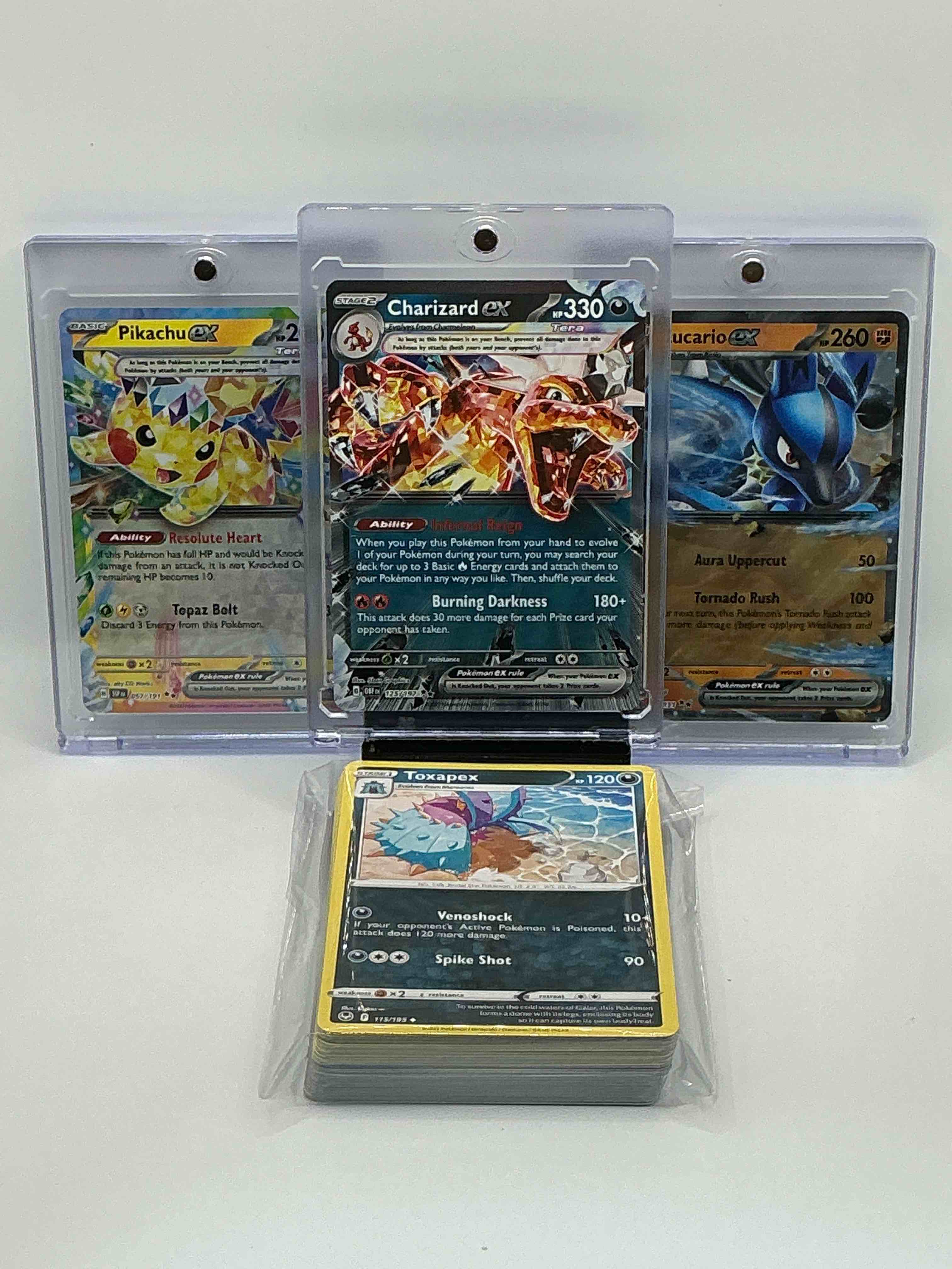 pokémon palooza! silver shimmer infernal reign burning darkness charizard ex! silver & orange shimmer aura uppercut tornado rush lucario ex! silver & yellow blast resolute heart topaz bolt pikachu ex! along with 50 other pokémon heroes, legends & commons!
