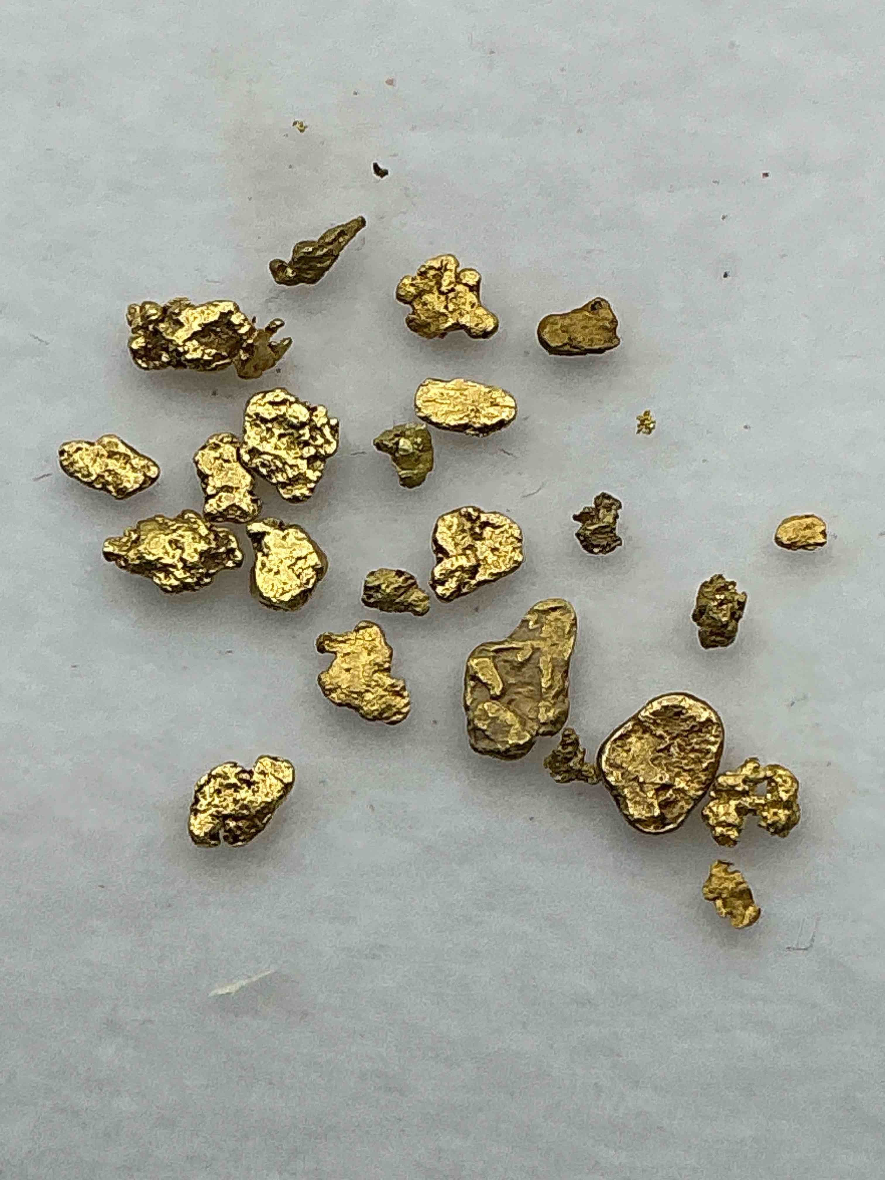 gold nuggets, authentic! wow! these are genuine pure gold nuggets prospected from north carolina. approximately 0.5 gm in total size/weight for all nuggets. this type of gold in nuggets form that has not been processed is extremely hard to find & is much more rare than processed gold in any form. u.s. dime shown in image is for visual size reference only (not included). own incredibly cool pieces of gold & an awesome investment in fine u.s. gold precious metal! every gold nugget is "one of a kind!"