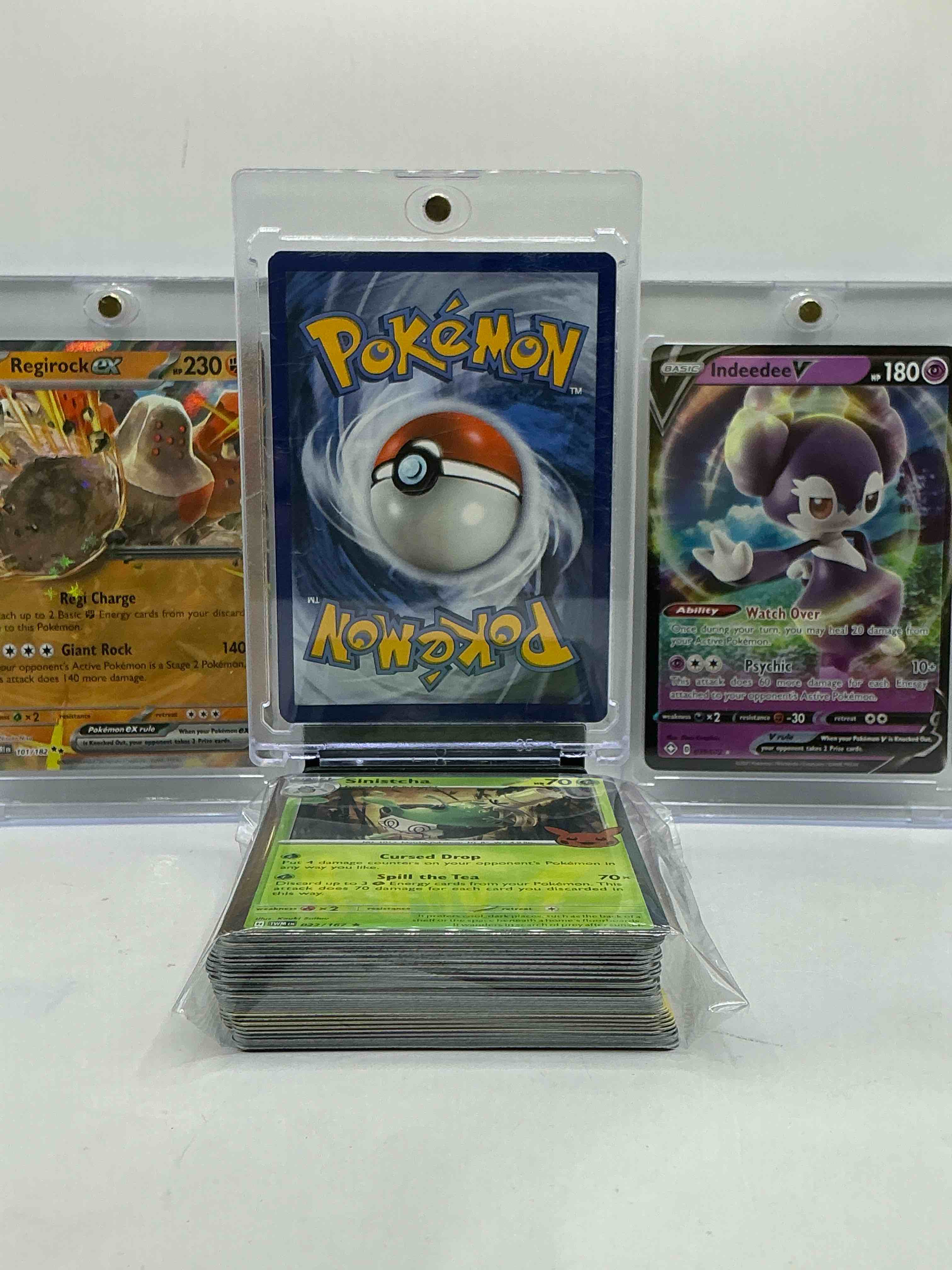 Condition photo showing New/Like New for Pikachu Holo, Indeedee V, Regirock & More! Insane Trio! This 50 Card Lot Includes Commons, Legends, Heroes & More! WOW! 