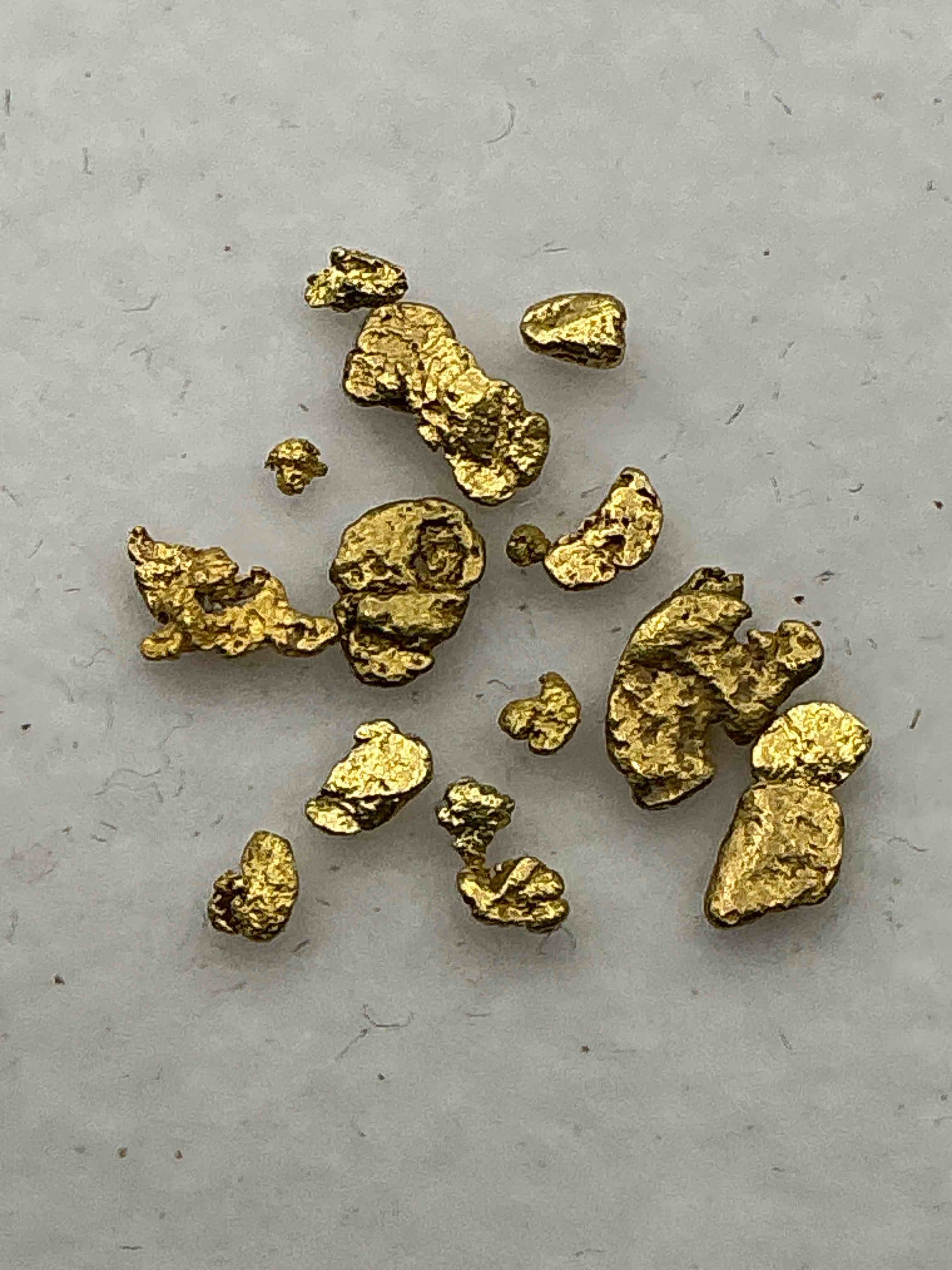 gold nuggets, authentic! wow! these are genuine pure gold nuggets prospected from north carolina. approximately 0.5 gm in total size/weight for all nuggets. this type of gold in nuggets form that has not been processed is extremely hard to find & is much more rare than processed gold in any form. u.s. dime shown in image is for visual size reference only (not included). own incredibly cool pieces of gold & an awesome investment in fine u.s. gold precious metal! every gold nugget is "one of a kind!"