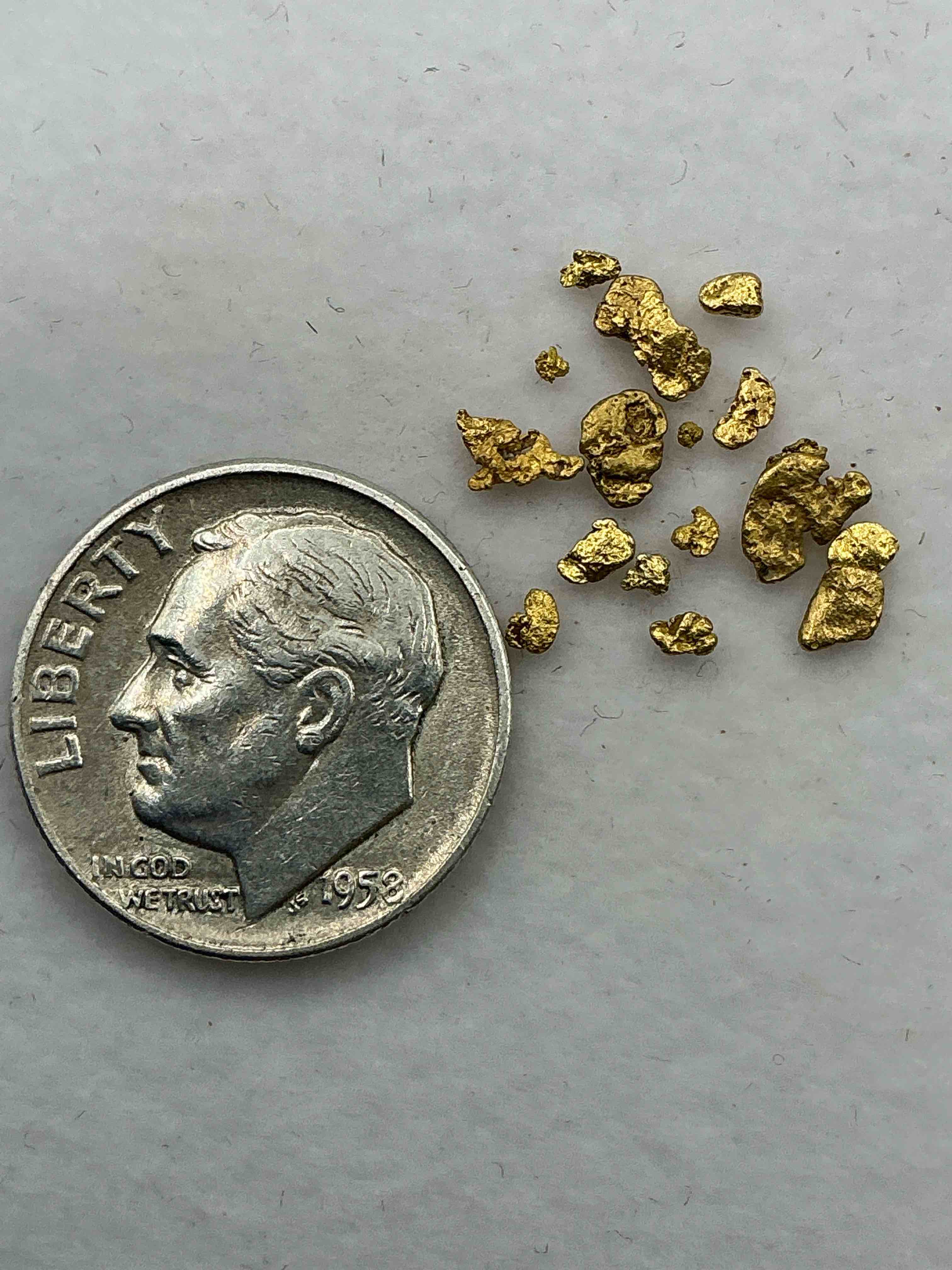Condition photo showing New/Like New for Gold Nuggets, Authentic! Wow! These Are Genuine Pure Gold Nuggets Prospected From North Carolina. Approximately 0.5 GM In Total Size/Weight For All Nuggets. This Type Of Gold In Nuggets Form That Has Not Been Processed Is Extremely Hard To Find & Is Much More Rare Than Processed Gold In Any Form. U.S. Dime Shown In Image Is For Visual Size Reference Only (Not Included). Own Incredibly Cool Pieces Of Gold & An Awesome Investment In Fine U.S. Gold Precious Metal! Every Gold Nugget Is "One Of A Kind!"