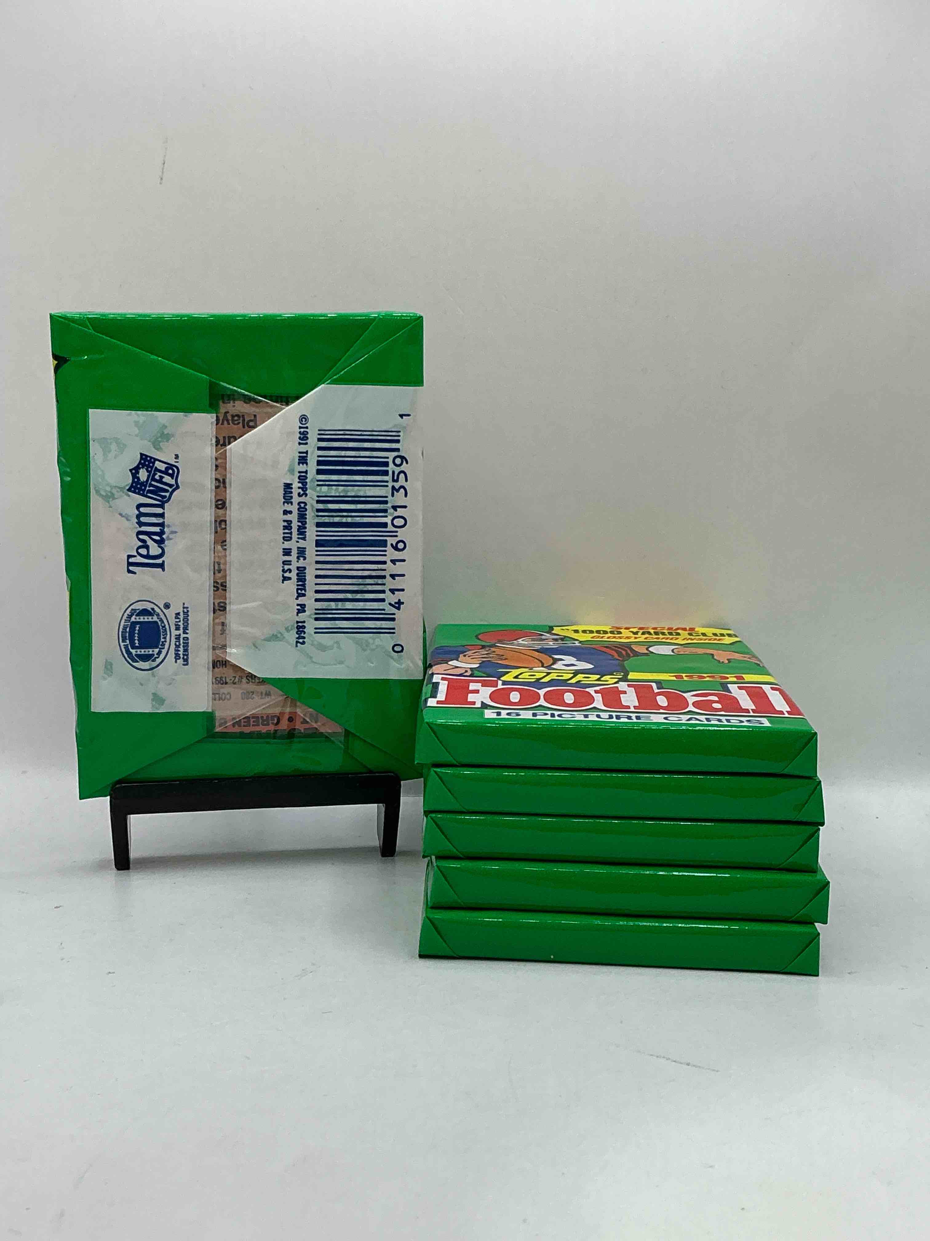 Condition photo showing New/Like New for 1991 Topps Football Unopened Sports Card Wax Pack, Direct From Original Retail Case. Search For Early Barry Sanders, Emmitt Smith, Jerry Rice & Joe Montana!