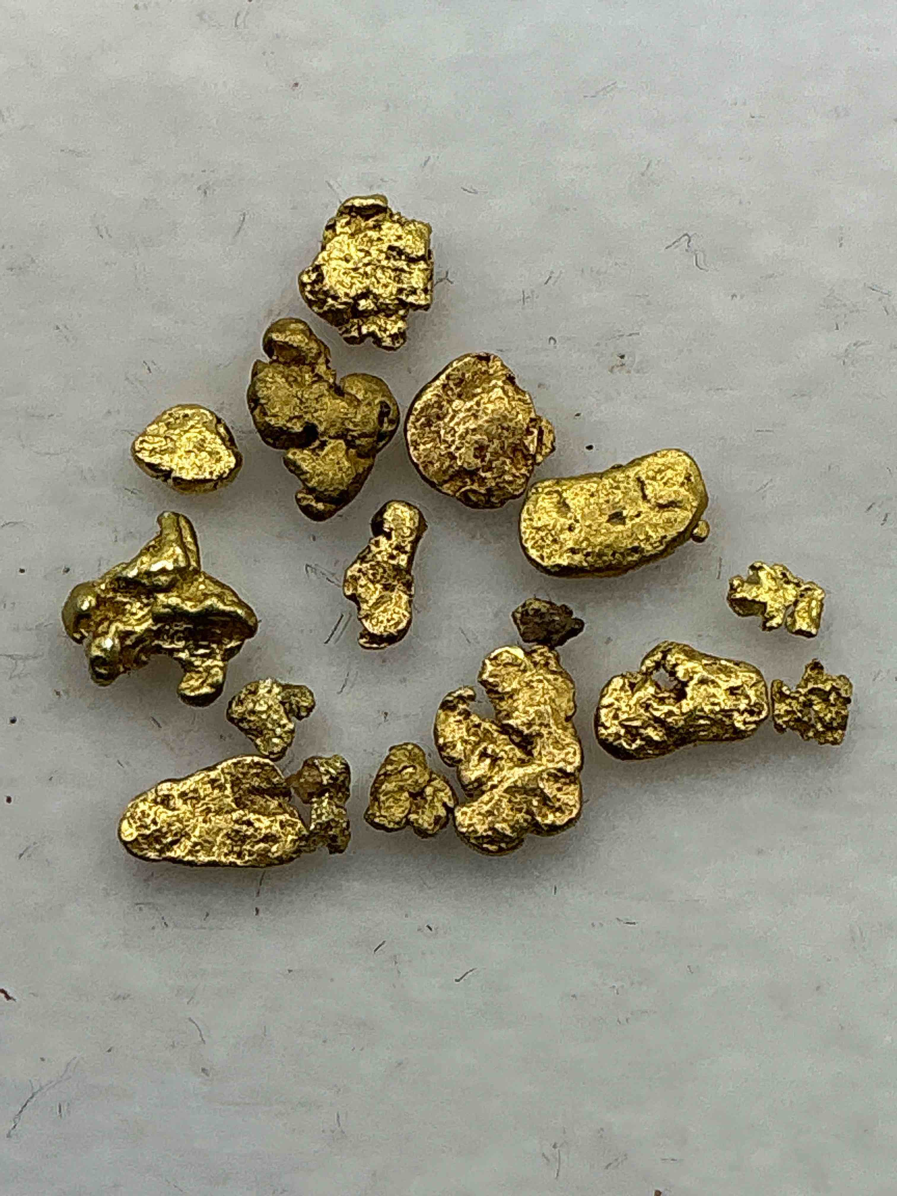 gold nuggets, authentic! wow! these are genuine pure gold nuggets prospected from north carolina. approximately 0.5 gm in total size/weight for all nuggets. this type of gold in nuggets form that has not been processed is extremely hard to find & is much more rare than processed gold in any form. u.s. dime shown in image is for visual size reference only (not included). own incredibly cool pieces of gold & an awesome investment in fine u.s. gold precious metal! every gold nugget is "one of a kind!"