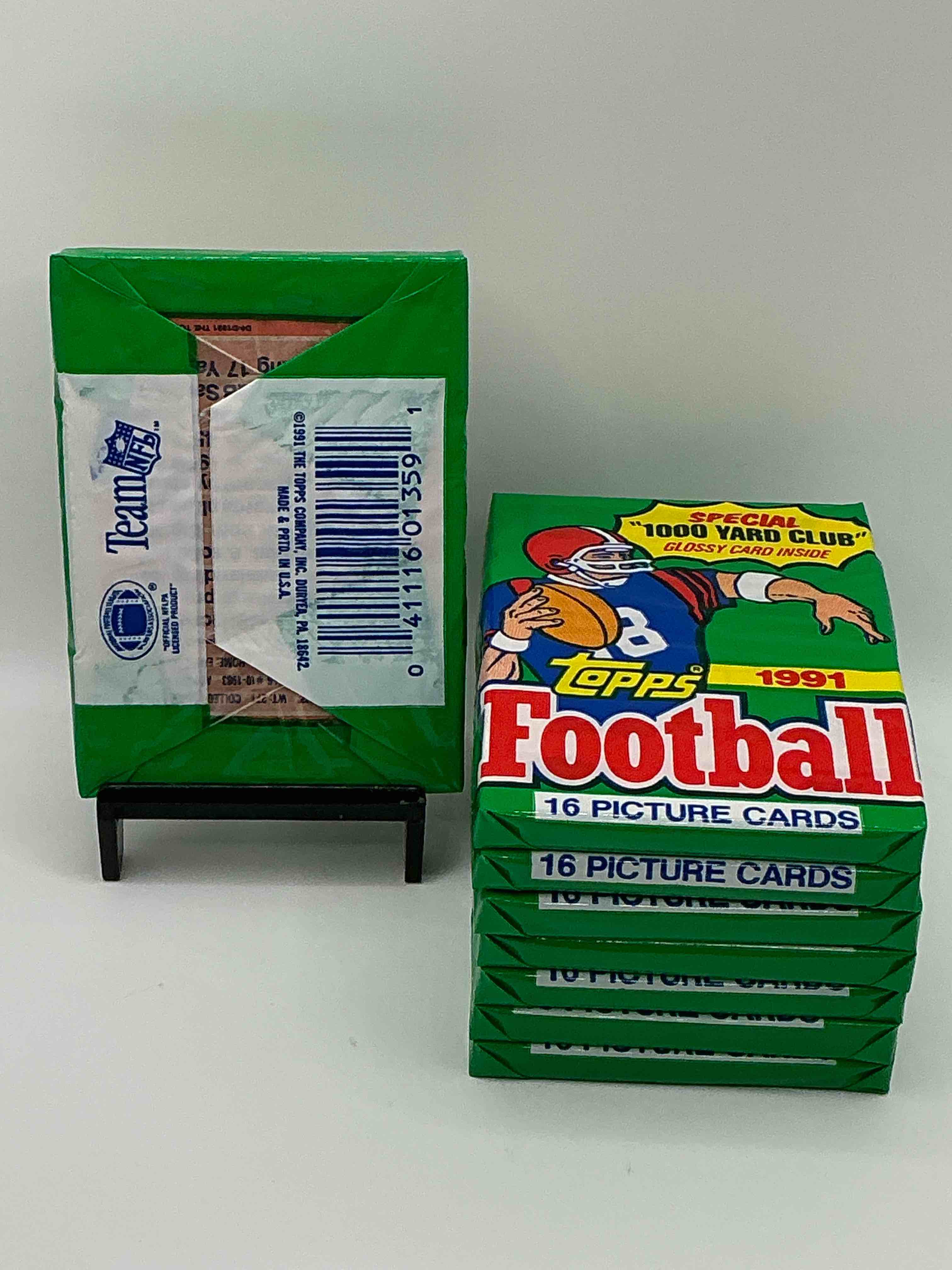 Condition photo showing New/Like New for 1991 Topps Football Unopened Sports Card Wax Pack, Direct From Original Retail Case. Search For Early Barry Sanders, Emmitt Smith, Jerry Rice & Joe Montana!