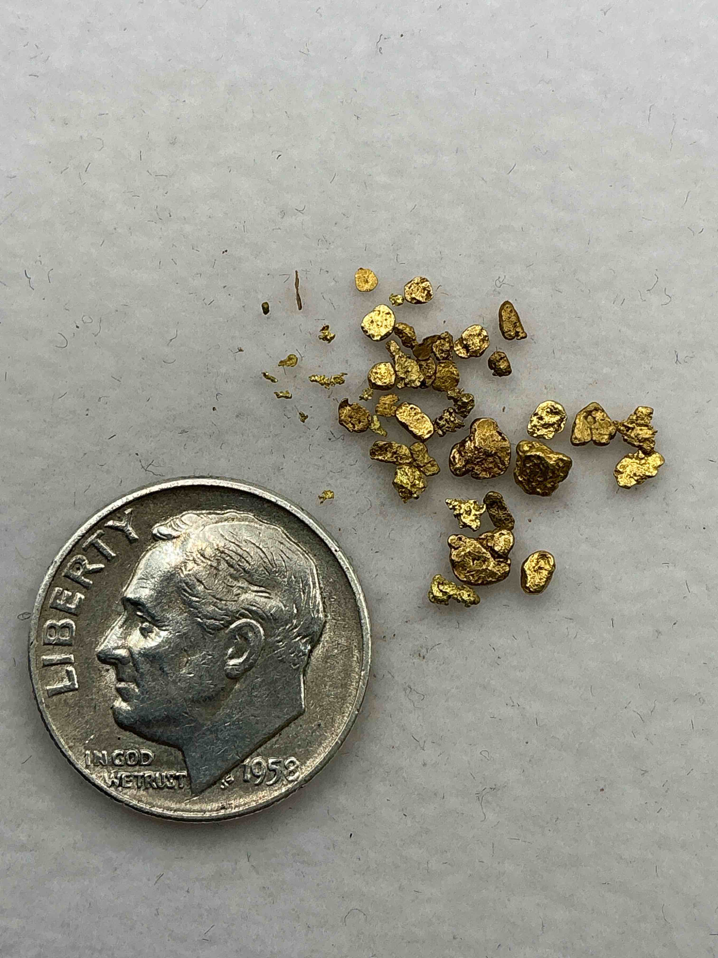 Condition photo showing New/Like New for Gold Nuggets, Authentic! Wow! These Are Genuine Pure Gold Nuggets Prospected From North Carolina. Approximately 0.5 GM In Total Size/Weight For All Nuggets. This Type Of Gold In Nuggets Form That Has Not Been Processed Is Extremely Hard To Find & Is Much More Rare Than Processed Gold In Any Form. U.S. Dime Shown In Image Is For Visual Size Reference Only (Not Included). Own Incredibly Cool Pieces Of Gold & An Awesome Investment In Fine U.S. Gold Precious Metal! Every Gold Nugget Is "One Of A Kind!"