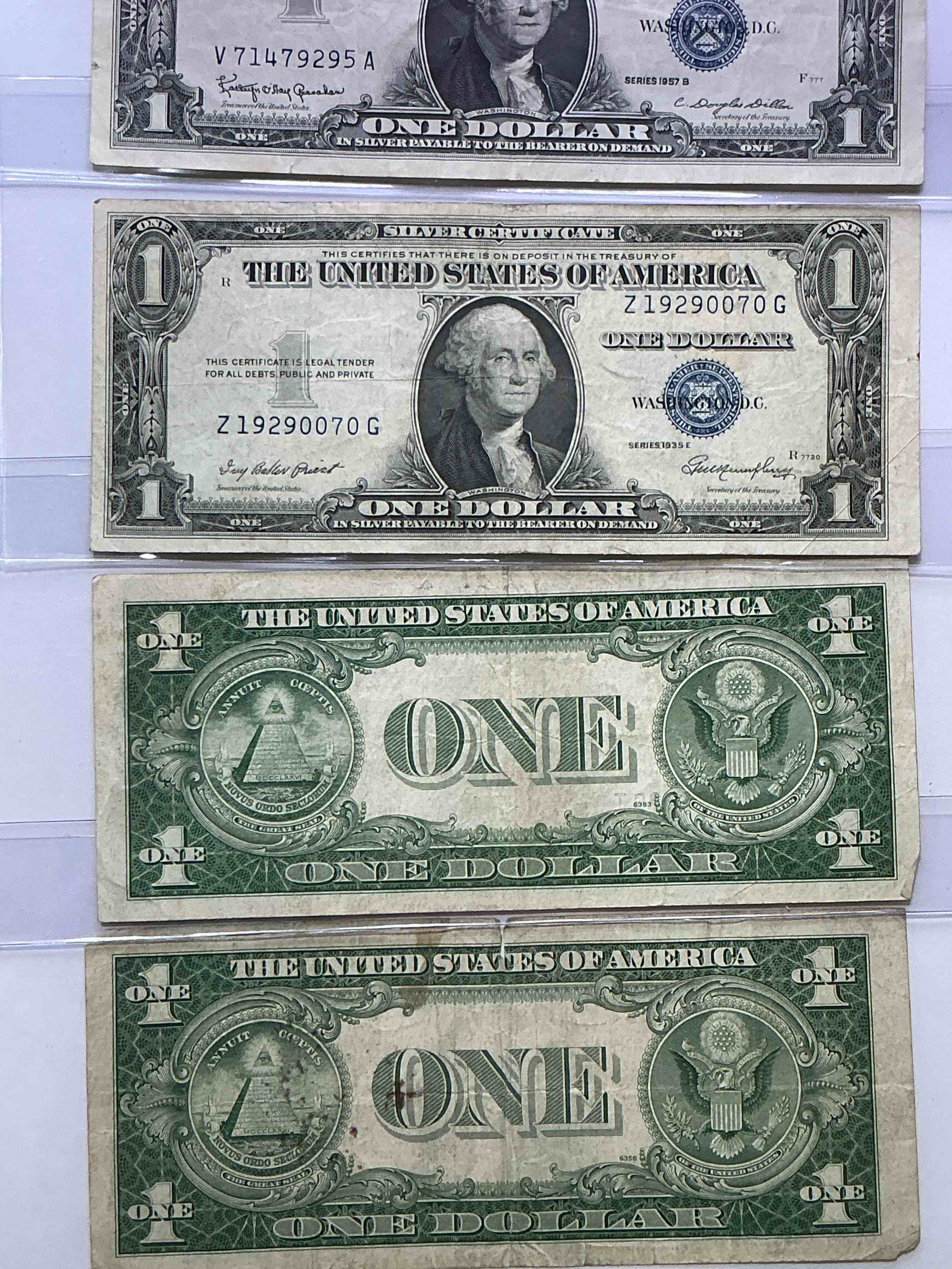 Condition photo showing New/Like New for 1957 & 1935 Silver Certificates! Did You Know That Prior To 1964 One Dollar U.S. Paper Money Was Actually Redeemable For Silver Dollars?! Wow How Times Have Changed! Silver Certificates Were Produced From 1878 To 1964 & Are Still Considered Legal Tender At Face Value. Here Are Gorgeous, Circulated 1935 & 1957 U.S. One Dollar Silver Certificate, With Highly Collectible "Blue Seal!* Own An Awesome Piece Of History!
