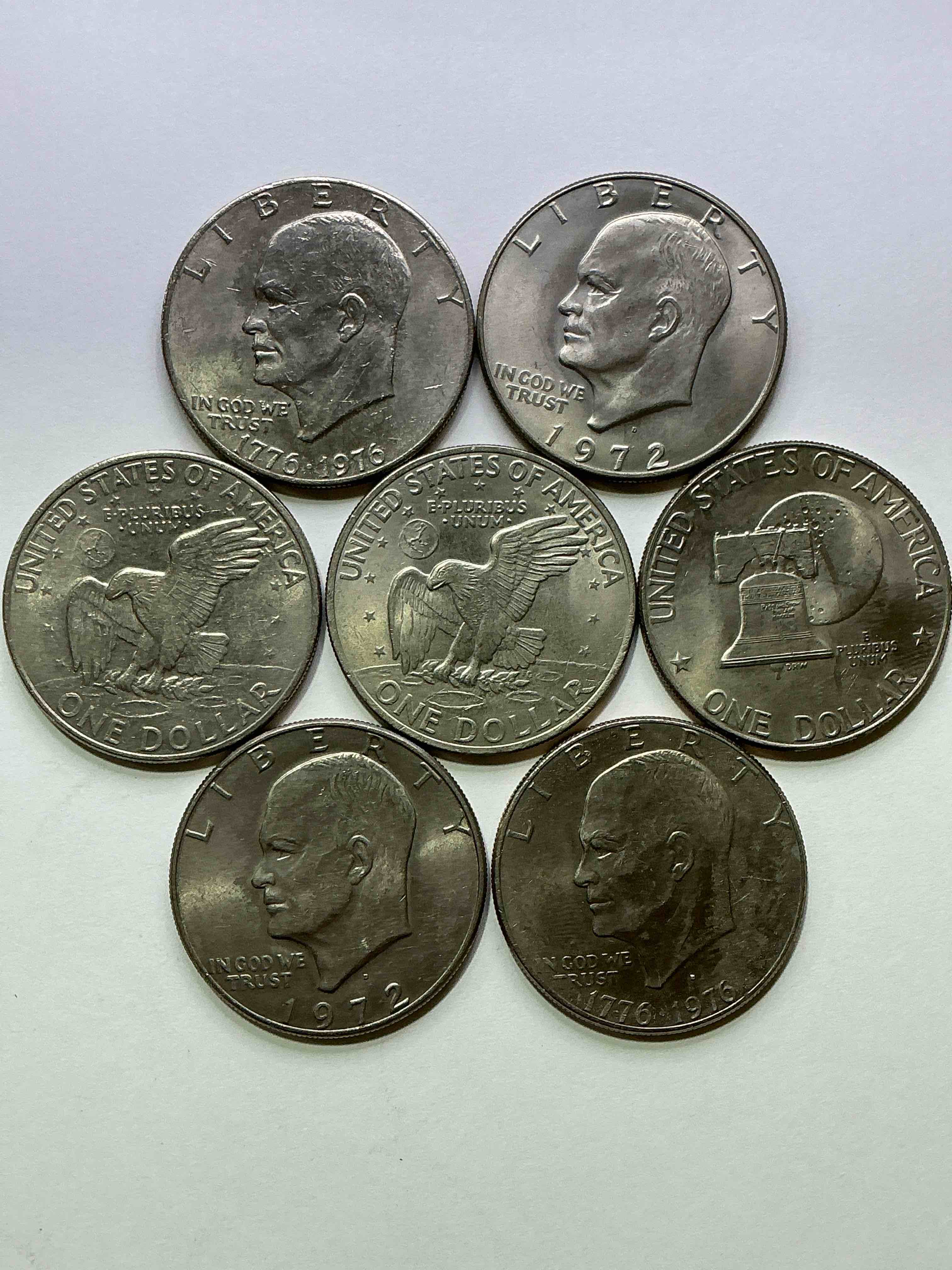 Condition photo showing Good Condition for Gorgeous Eisenhower Dollar Coins! These Striking, Large U.S. Coins Were Minted From 1971-1978. Here Are Gorgeous Examples Of “Ike" Dollars From 1976 & Other Years! These Coins Have Become Immensely Popular With Collectors & Some Have Great Toning!