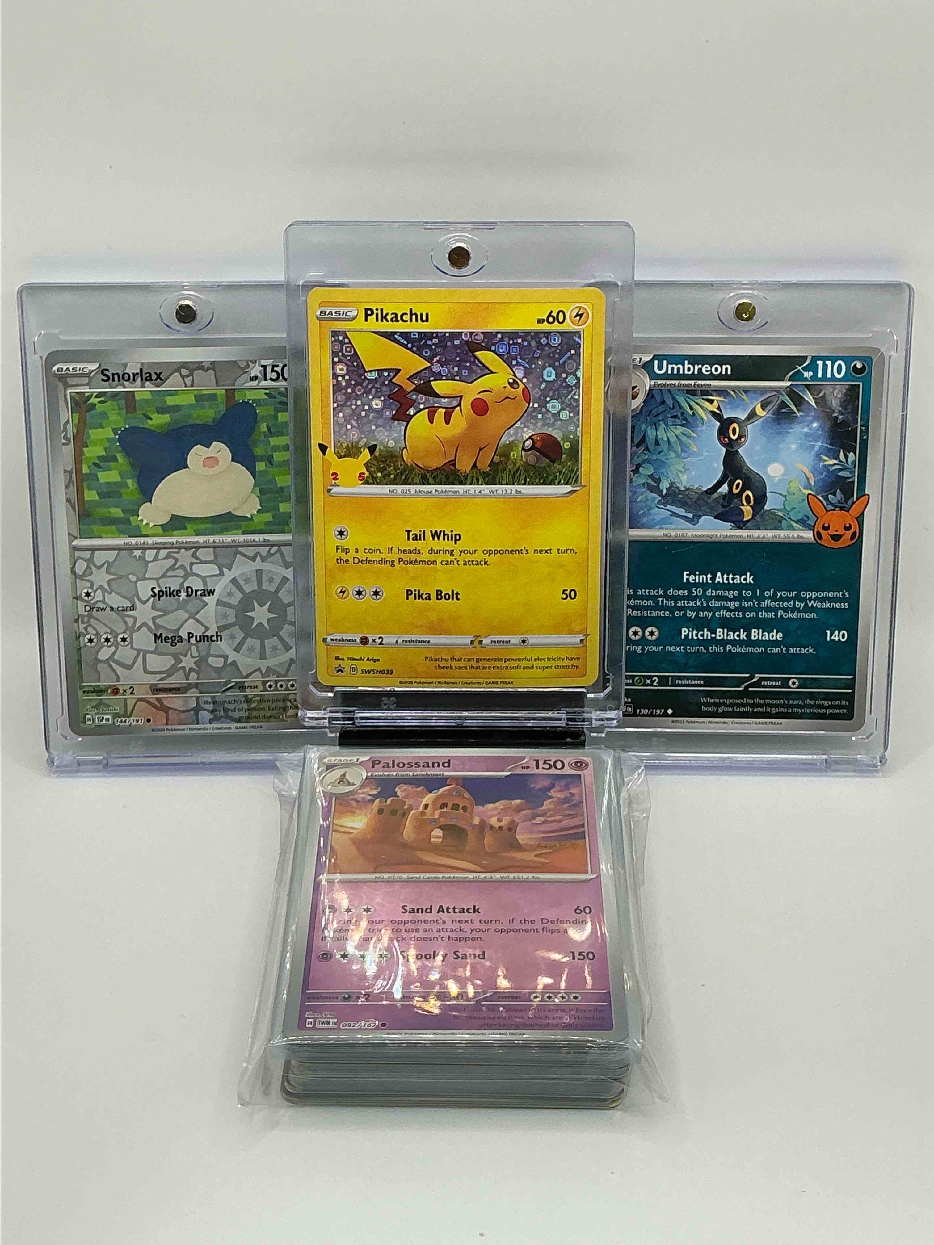 pokémon palooza! yellow & silver shimmer tail whip pika bolt pikachu! silver & blue feint attack pitch-black blade umbreon! silver & green spike draw mega punch snorlax! along with 50 other pokémon heroes, holos, legends & commons!