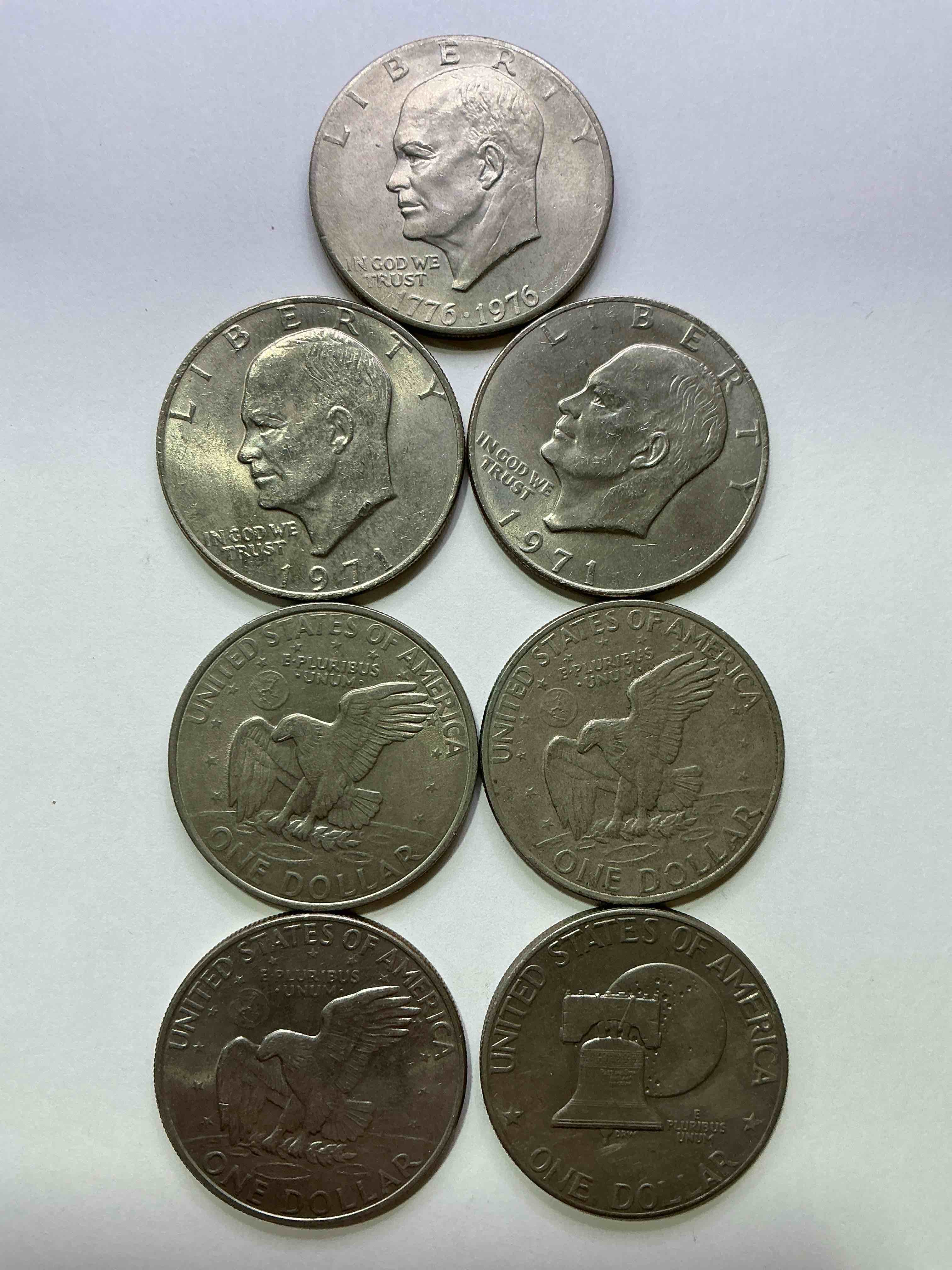 Condition photo showing Good Condition for Gorgeous Eisenhower Dollar Coins! These Striking, Large U.S. Coins Were Minted From 1971-1978. Here Are Gorgeous Examples Of “Ike" Dollars From 1976 & Other Years! These Coins Have Become Immensely Popular With Collectors & Some Have Great Toning!