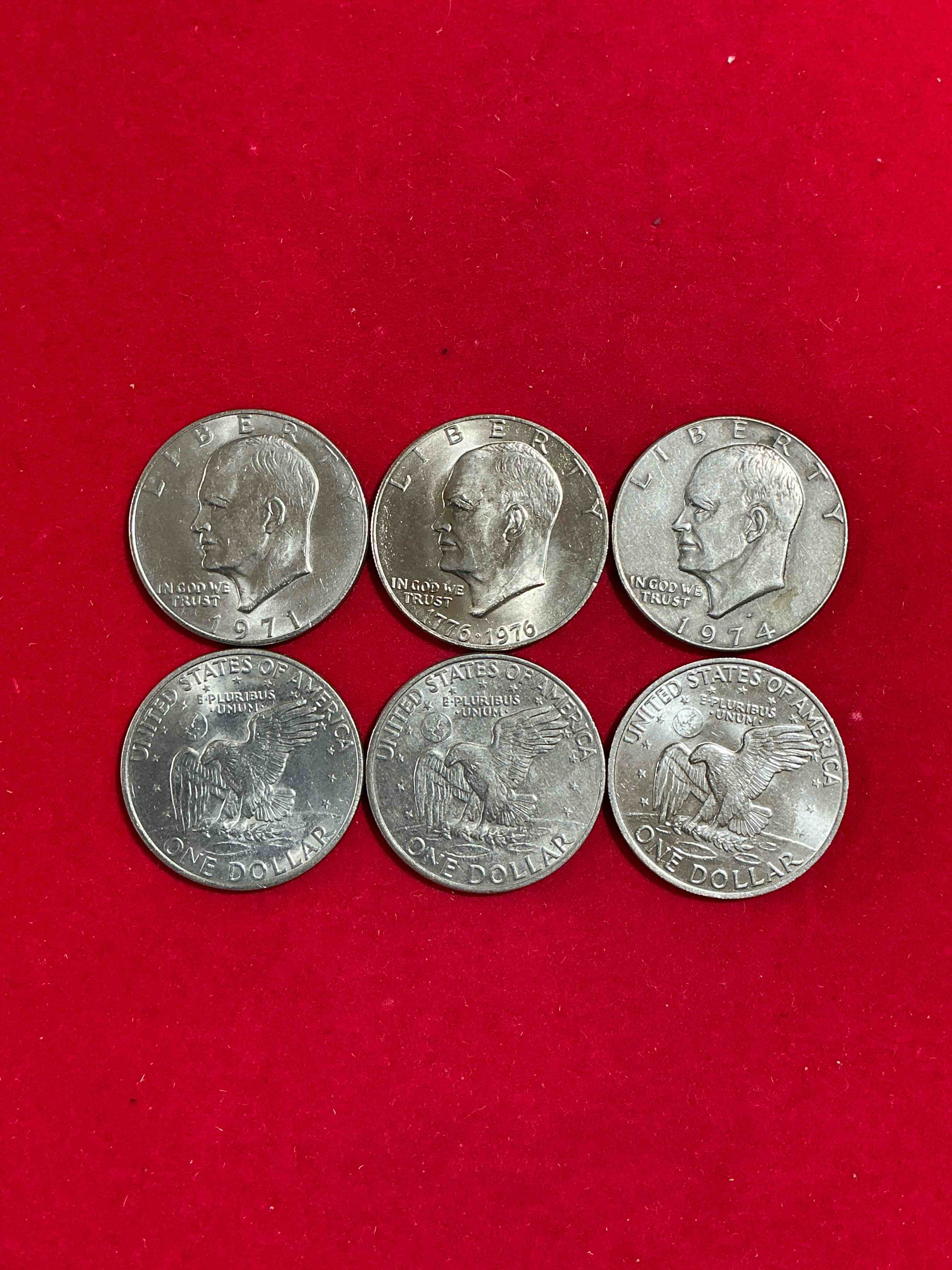 Condition photo showing Good Condition for Gorgeous Eisenhower Dollar Coins! These Striking, Large U.S. Coins Were Minted From 1971-1978. Here Are Gorgeous Examples Of “Ike" Dollars From 1976 & Other Years! These Coins Have Become Immensely Popular With Collectors & Some Have Great Toning!
