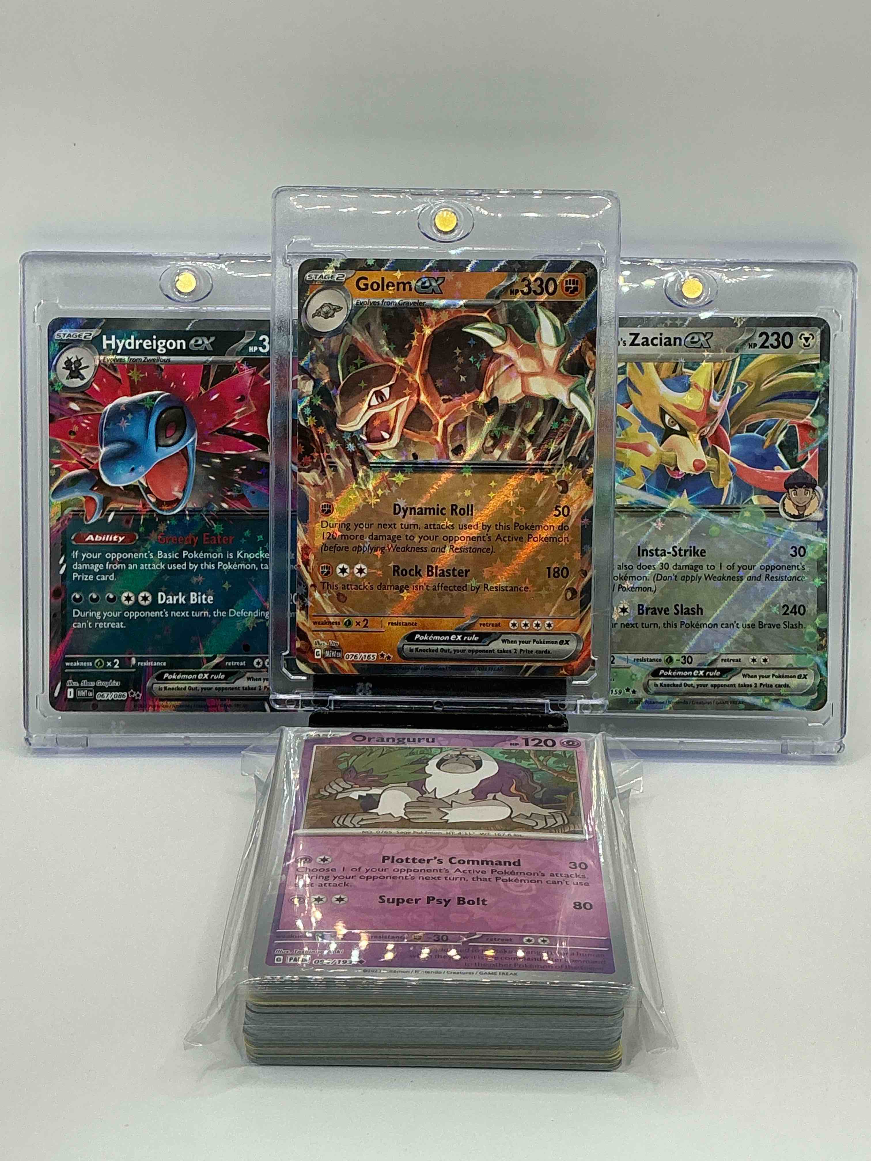 Pokémon Palooza! Silver & Orange Shimmer Dynamic Roll Rock Blaster Golem EX! Silver & Blue Shimmer Greedy Eater Dark Bite Hydreigon EX! Silver & Green Shimmer Insta-Strike Brave Slash Hop’s Zacian EX! Along With 50 Other Pokémon Heroes, Holos, Legends & Commons!