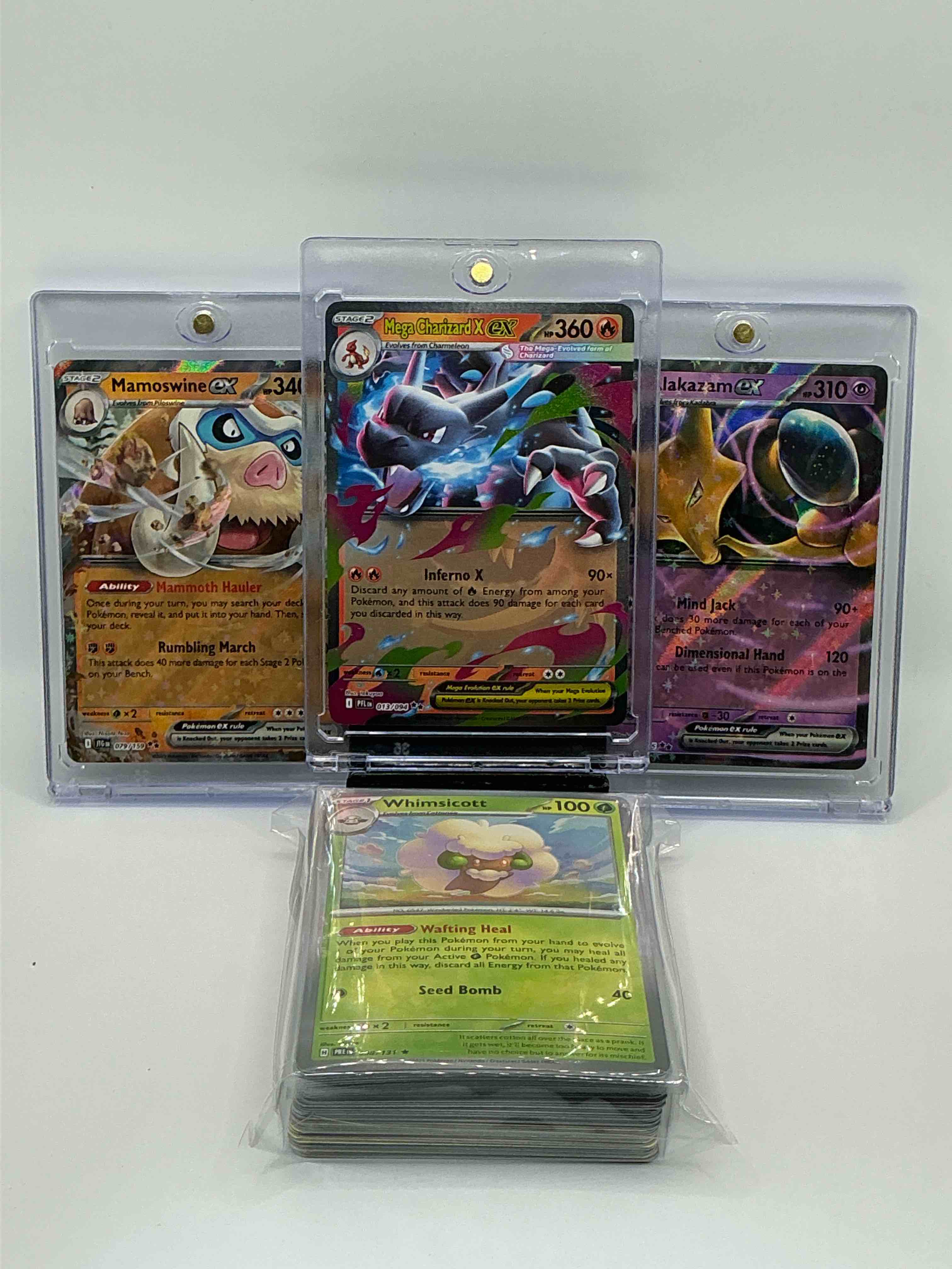 Pokémon Palooza! Silver & Blue Shimmer Inferno X Mega Charizard X EX! Silver & Orange Mammoth Hauler Rumbling March Mamoswine EX! Silver & Purple Shimmer Mind Jack Dimensional Hand Alakazam EX! Along With 50 Other Pokémon Heroes, Holos, Legends & Commons!